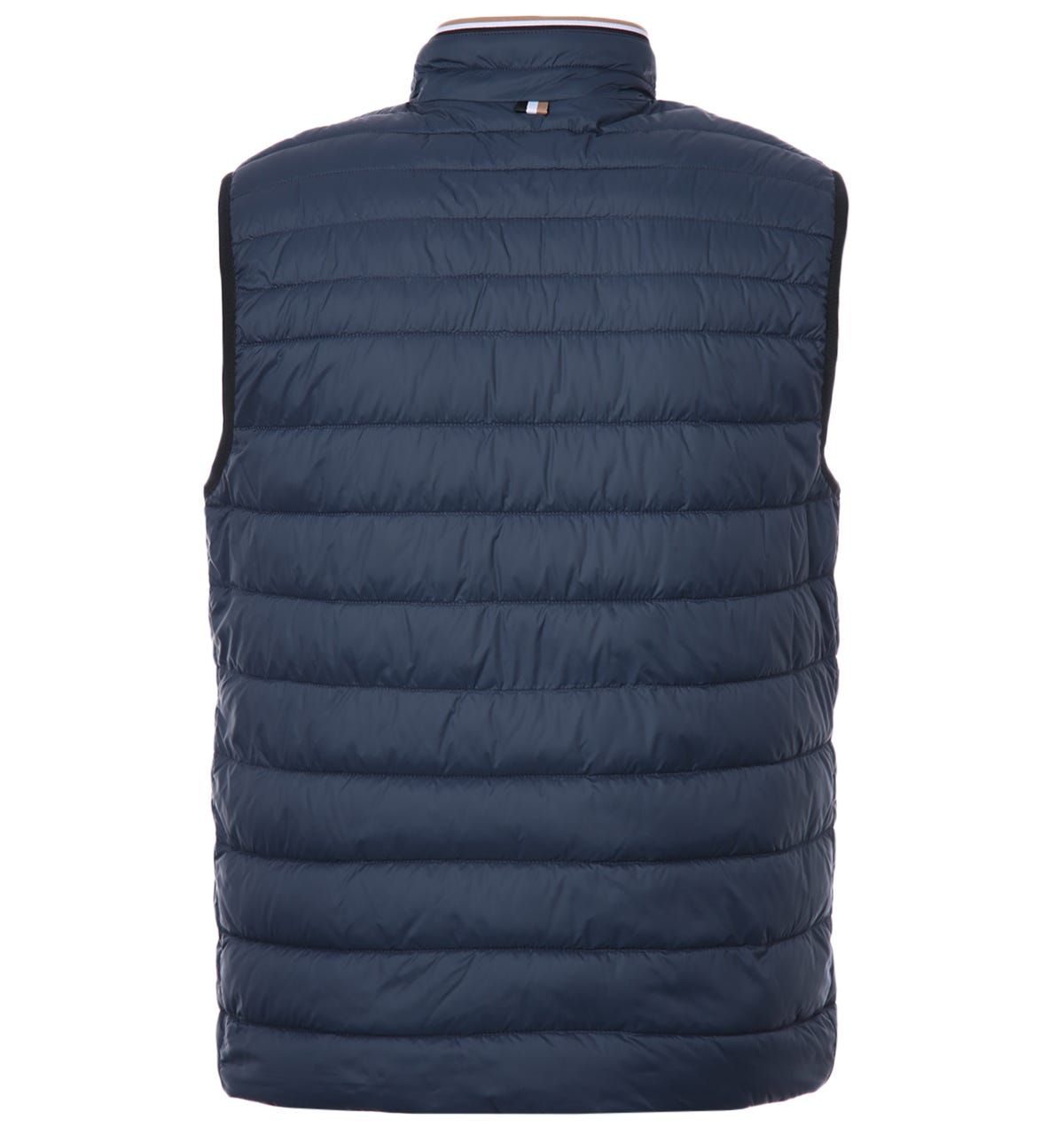 This water repellent packable down gilet from BOSS is the perfect piece to elevate your outerwear and stay warm this season. Crafted from a water repellent recycled polyamide providing comfort and sophistication. Featuring a stand up collar with brand colours, elasticated trims and functional welt snap button pockets. Finished with subtle BOSS branding.Regular Fit, Stand Collar with Full Zip Closure, Recycled Nylon, Water Repellant, Twin Snap Button Welt Pockets, BOSS Branding. Style & Fit:Regular Fit, Fits True to Size. Composition & Care:100% Recycled Polyamide, Machine Wash.