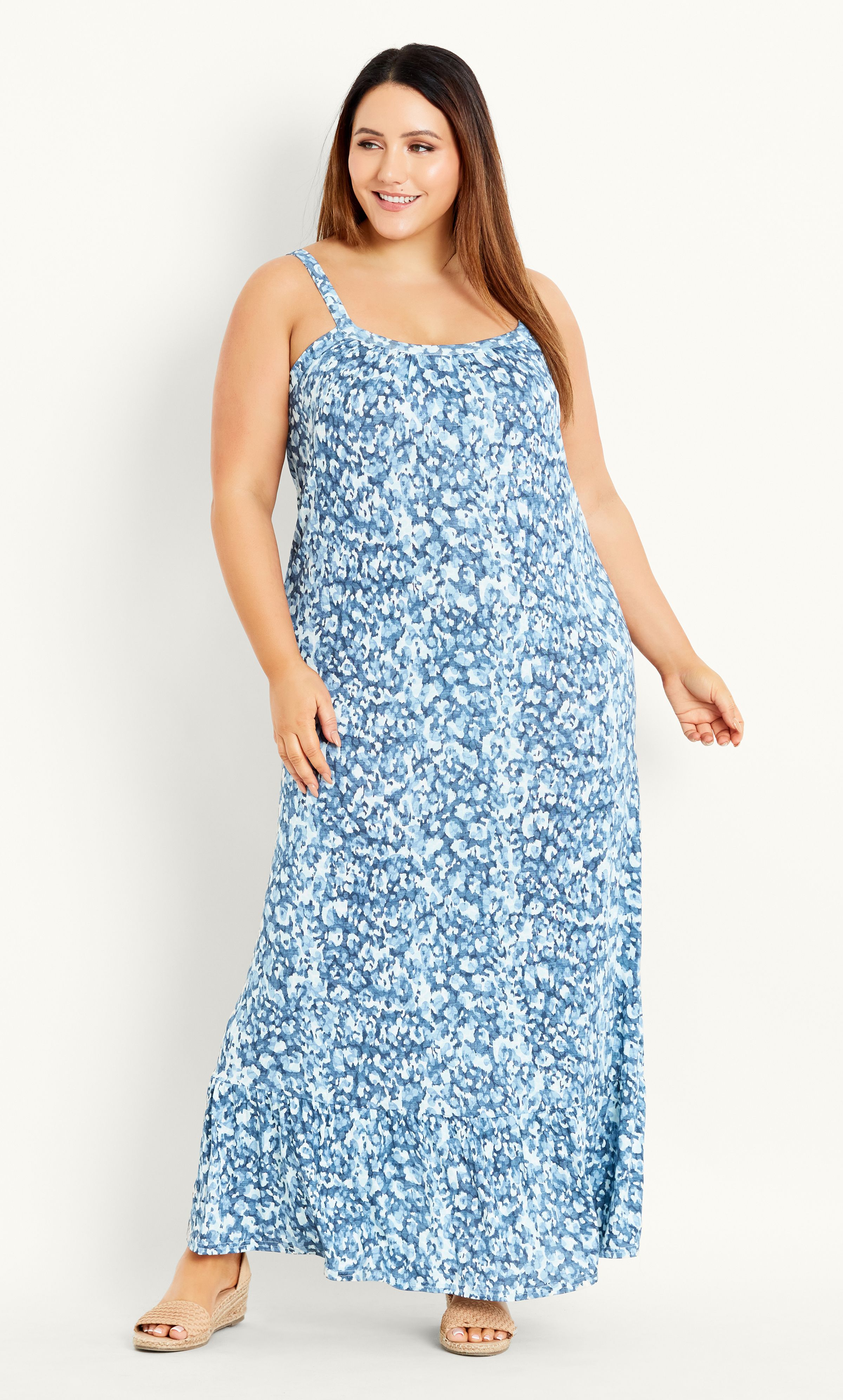 Add a pop of print to your summer rotation with the vibrant Smudge Print Maxi Dress. Featuring a scoop neckline, relaxed fit and all-over blue print, this maxi dress delivers on effortless & striking warm weather style. Key Features Include: - Scoop neckline - Thin shoulder straps - Frilled hemline - Relaxed fit - Stretch fabrication Style with tan sandals and a cross-body bag for an easy everyday look.