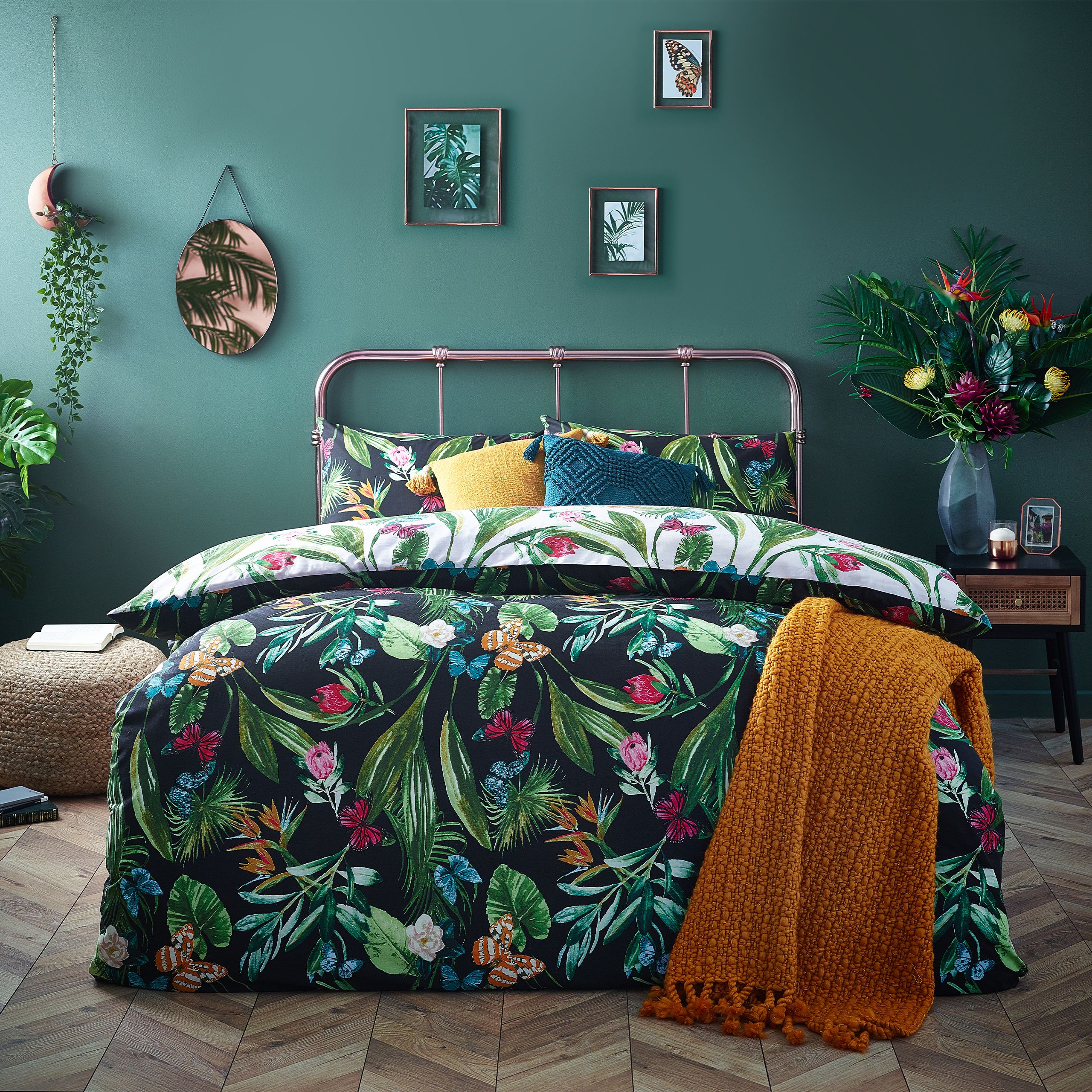 Add a pop of colour to your bedroom with this vibrant botanical duvet cover. The bright butterflies flutter onto the reverse against a neutral base so you can switch the look when you need to.
