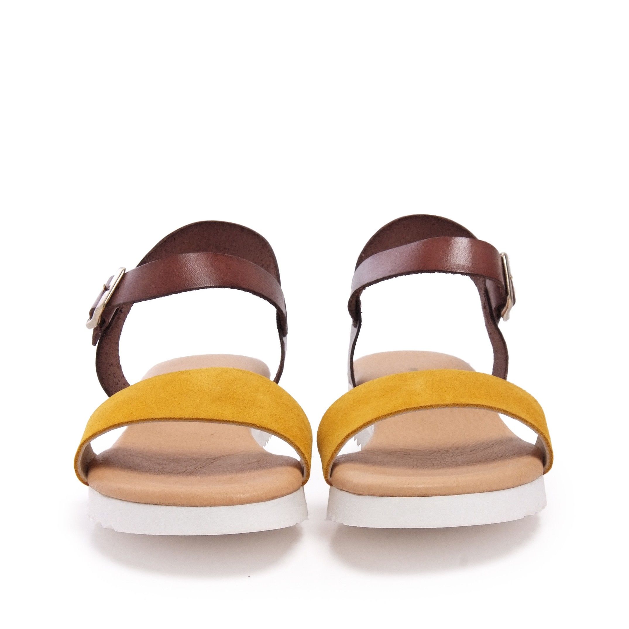 Leather flat sandal with two wide strips. Closure: adjustable metal buckle. Upper: lether. Inner: tissue. Insole: leather. Wedge: 2,5 cm. Platform: 1 cm. Sole: Non-skid TR. MADE IN SPAIN.