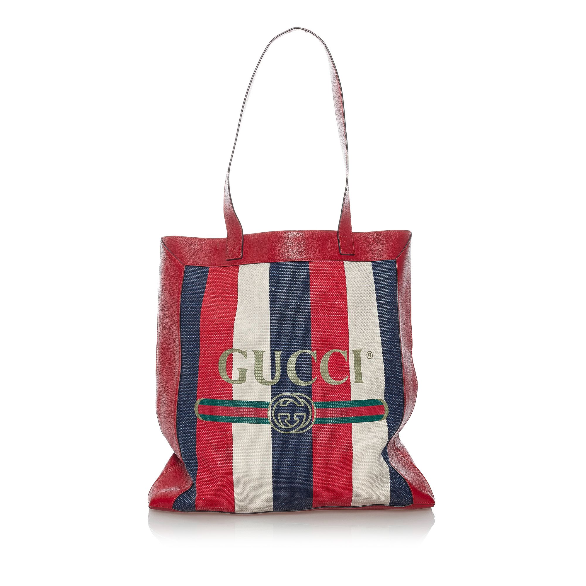 VINTAGE. RRP AS NEW. The 2018 Logo Striped tote bag features a printed canvas body with leather trim, a flat leather straps, an open top, and an interior zip pocket.Exterior back is discolored, out of shape and scratched. Exterior bottom is out of shape. Exterior corners is scratched. Exterior front is discolored, out of shape, scratched and stained. Zipper is scratched and tarnished. Interior lining is discolored.

Dimensions:
Length 43cm
Width 40cm
Depth 7cm
Hand Drop 29cm
Shoulder Drop 29cm

Original Accessories: Dust Bag

Serial Number: 523781
Color: Red x Multi
Material: Fabric x Canvas x Leather x Calf
Country of Origin: Italy
Boutique Reference: SSU156728K1342


Product Rating: GoodCondition

Certificate of Authenticity is available upon request with no extra fee required. Please contact our customer service team.