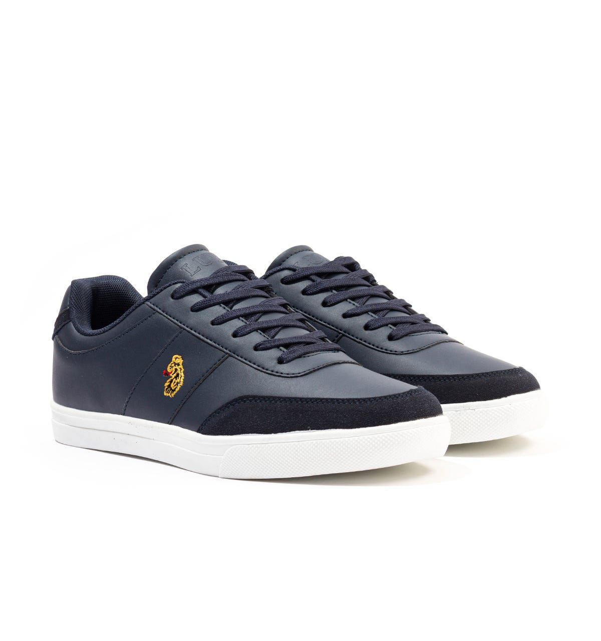 Luke 1977 is, without a doubt, the go-to brand if you\'re after well crafted, witty and masculine products. Finished with the signature Luke Lion logo, you\'re looking at one of the UK\'s top contemporary menswear brands.The Wells Trainers are crafted from durable PU leather uppers with suede trims, in a classic low-top style. Featuring a six eyelet lace up and signature Luke branding to the heel, tongue and side.PU Leather UppersTextile LiningPU Suede TrimsRubber CupsolesLow-Top StyleSix Eyelet Lace UpLuke 1977 Branding