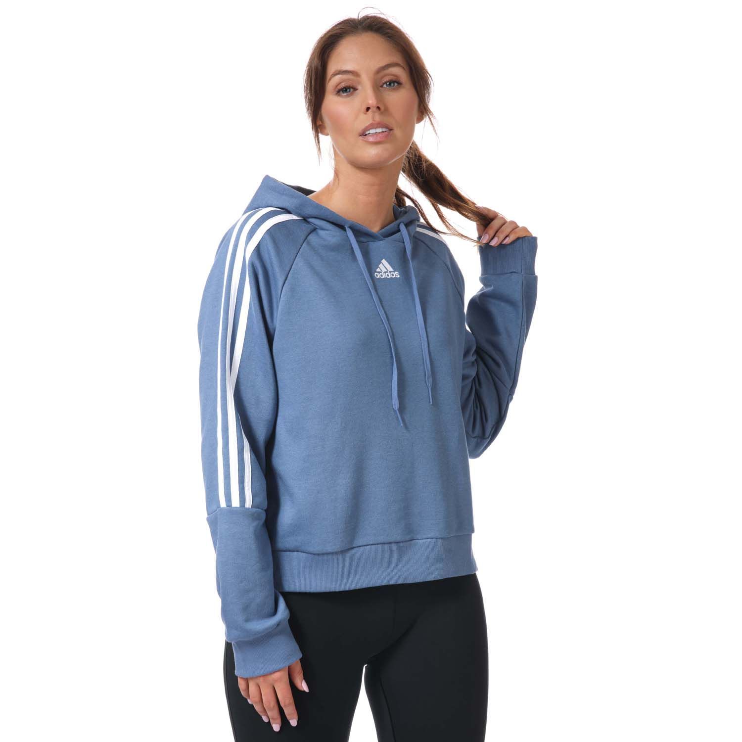 Womens adidas Essentials 3- Stripes Cropped Hoody in blue.- Drawcord-adjustable hood.- Long sleeves.- Ribbed cuffs and hem.- 3-Stripes down both arms.- adidas Badge of Sport logo on the chest.- Loose fit.- Main Material: 53% Cotton  36% Polyester (Recycled)  11% Rayon. Hood Lining: 100% Cotton. - Ref:GL1461