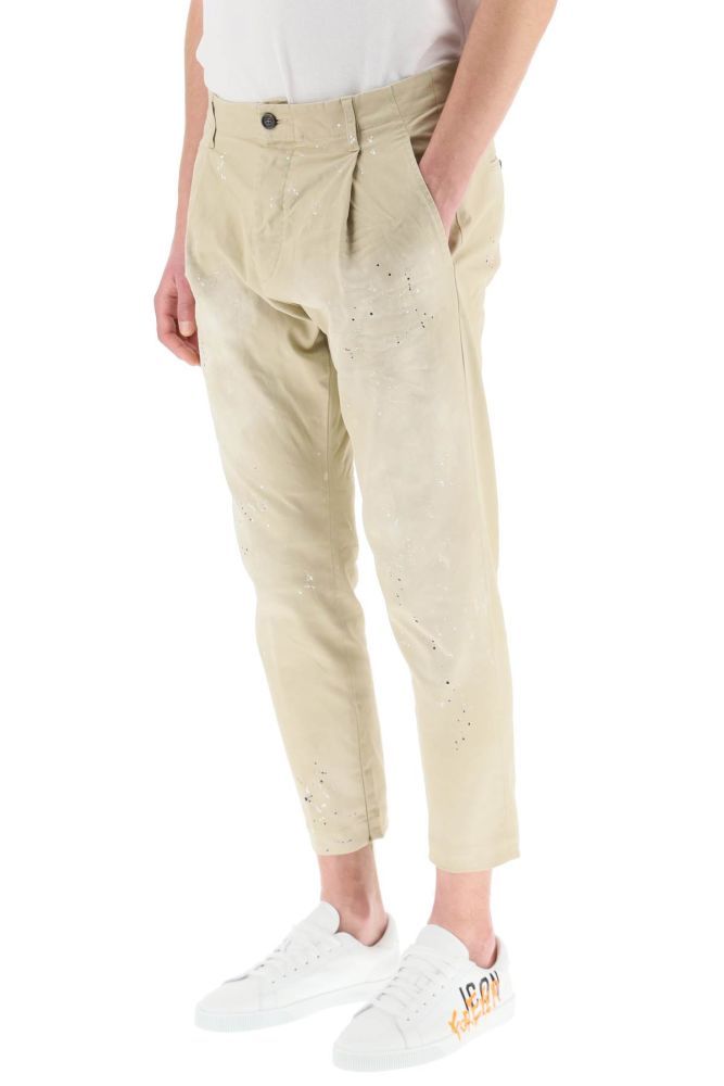 Dsquared2 chino trousers in stretch gabardine with spotted-look finish. Hand Me Down fit featuring low waist, front pleat and slim leg with cropped length. Invisible zip at the ankles, button fly, four pockets. 
