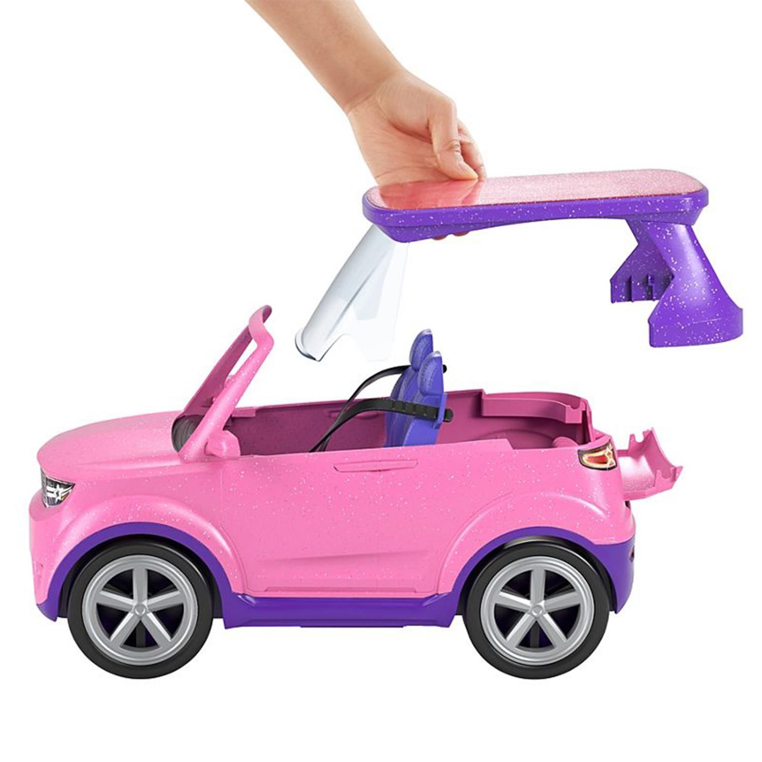 Imaginations can hit the road and play out rockin’ adventures with this transforming Barbie® vehicle playset inspired by Barbie: Big City, Big Dreams™ ! Ready to take the show on the road? Buckle two Barbie® dolls in (dolls sold separately), then park and transform the vehicle to set the scene for a pop-up performance! The glittery pink SUV features a removeable roof that becomes a stage, removeable seats that become seating for an audience and over 20 storytelling accessories including a drum set and stool, speaker and turntable, microphones and more. Future stars ages 3 years old and up can dream up all kinds of big adventures with this transforming Barbie® vehicle! Dolls sold separately. Colors and decorations may vary.

Features:

This Barbie® vehicle playset inspired by Barbie: Big City, Big Dreams™ transforms to reveal a stage and seating for a pop-up performance!
Take the show on the road in a glittery pink and purple SUV with rolling wheels, realistic details and room for 2 Barbie® dolls (sold separately).
Remove the roof to set up a stage for Barbie® doll and remove the seats to create a place for the audience to cheer her on!
Over 20 storytelling pieces include a drum set, speaker and turntable, microphones, snacks, backstage passes, smart phone accessories and more!
Pack the pieces back inside the car for easy clean-up.
With so many storytelling opportunities, this Barbie: Big City, Big Dreams™ vehicle playset makes a great gift for 3 to 7 year olds, especially those that love the spotlight!

Box Contains: Barbie Big City and Big Dream Playset.

Playset Includes: Transforming SUV Car, Handbags, Microphones, Snacks, Backstage Passes, Smart phone accessories, Drum set, Speaker.