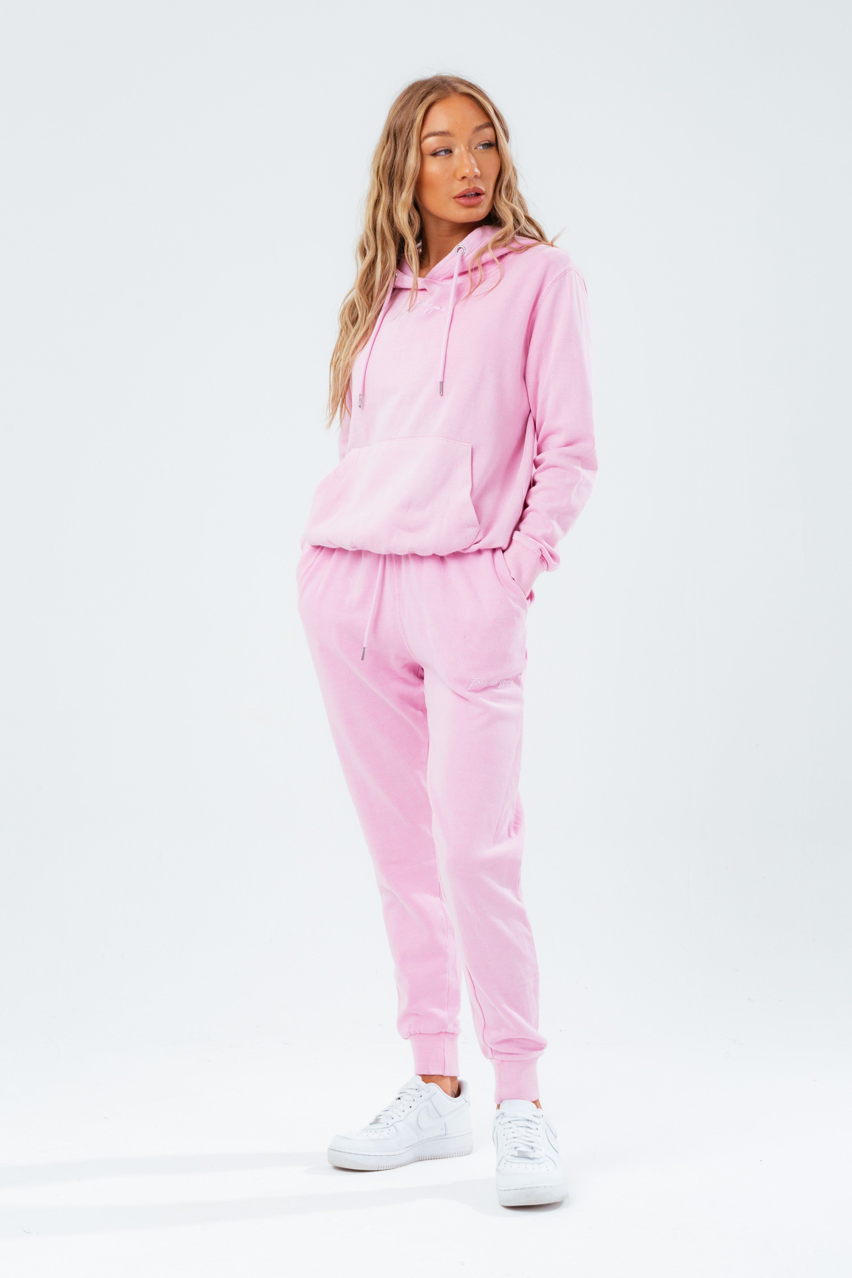 Stay on trend with the Hype Washed Baby Pink Scribble Logo Women's Joggers and grab the matching hoodie to complete the set. Designed in a soft-touch 70% Cotton 30% Polyester fabric base with the supreme amount of comfort you need from your new joggers. The design boasts an acid wash or tie-dye wash finish with an elasticated waistband, drawstring pullers and fitted cuffs. Machine wash at 30 degrees.