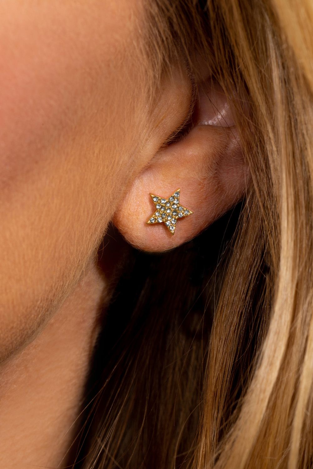 This might just be the cleverest earring design you ever did see! One earring, three ways to work it! First as a simple sparkling star stud, then simply attach the gorgeous cascading stars one of two ways, either behind or in front of the ear for two glammed up looks that are bang on trend this  season. These gold plated star earrings move delicately and shimmer in the light, and can be teamed as a set with the matching Sparkling Stars gold necklace and bracelet.