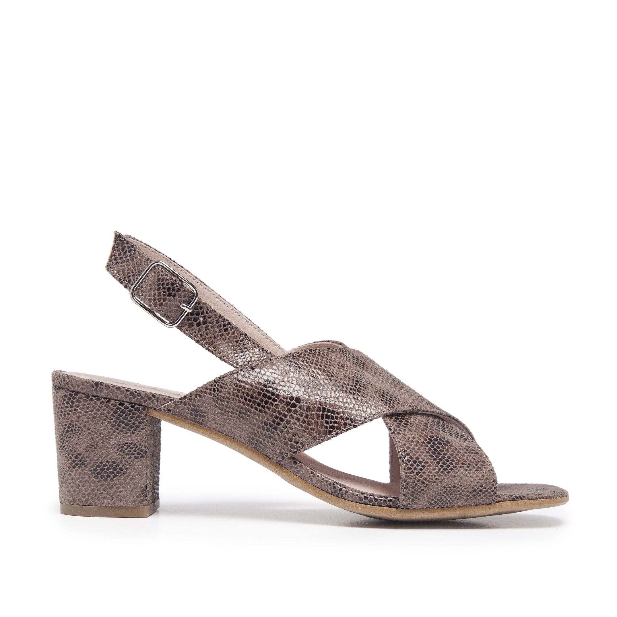 Leather sandals with straps and half-height heel. Adjustable closure with metal buckle. Upper made of synthetic. Inner made of leather. Insole made of leather. Heel: 5.5 cm. Sole: Cuerolite. This product is manufactured in Spain.