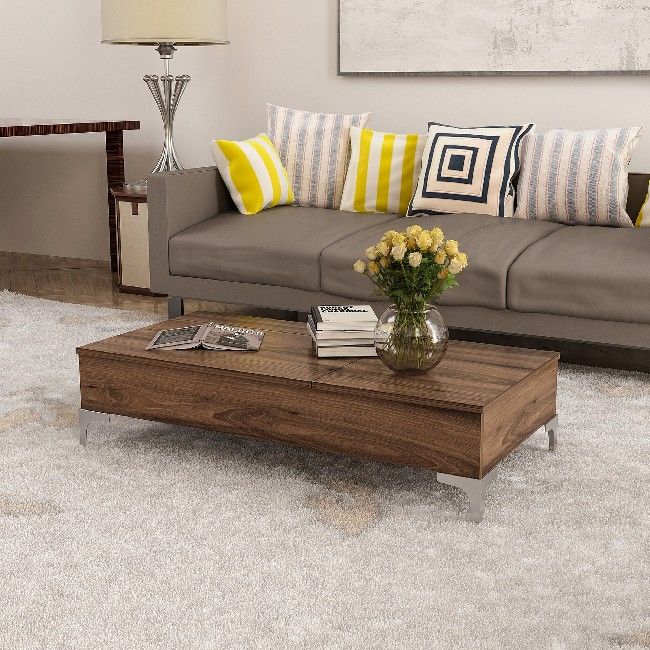 This stylish and functional coffee table is the perfect solution for furnishing the living area and keeping magazines and small items tidy. Easy-to-clean, easy-to-assemble kit included. Color: Walnut | Product Dimensions: W121xD60xH30 cm | Material: Melamine Chipboard, Metal | Product Weight: 24,8 Kg | Supported Weight: 20 Kg | Packaging Weight: W127xD55xH12 cm Kg | Number of Boxes: 1 | Packaging Dimensions: W127xD55xH12 cm.