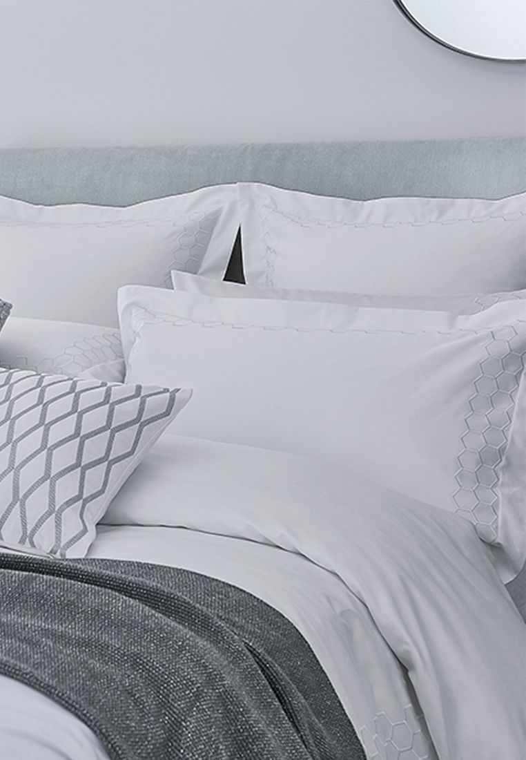 This effortlessly chic design features a contemporary geometric pattern embroidered onto smooth 300 thread count cotton sateen. The range includes duvet covers in four sizes complemented by oxford, standard and large standard pillowcases. Available in 2 stylish colourways, Damson and Platinum, each can be accessorised with the complementary cushions and throws from the Peacock Blue Hotel Collection. Made in China.