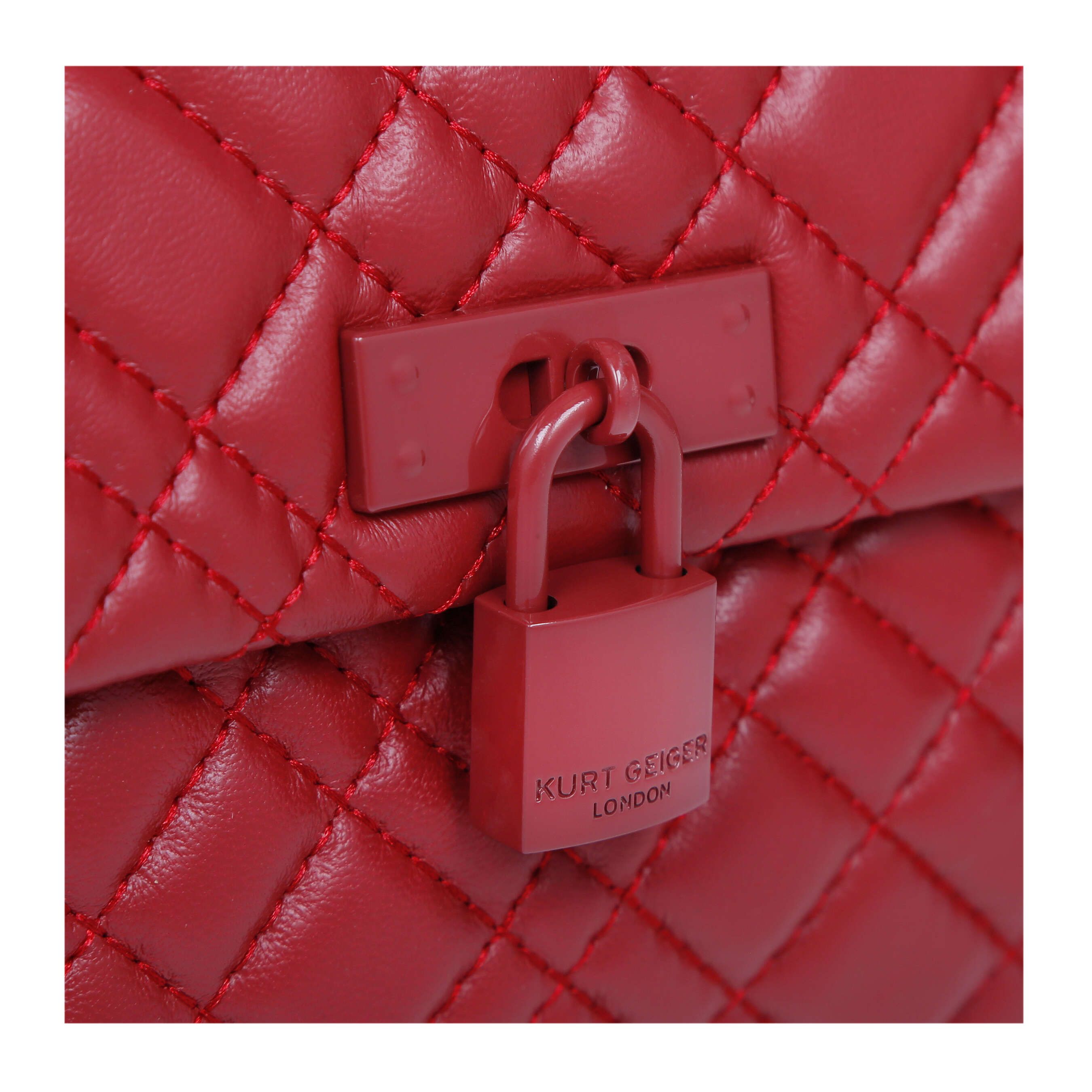 The KGL Mini Brixton Lock Bag is crafted in leather with overstitch quilting design. The wine red lock features branding on the front flap.