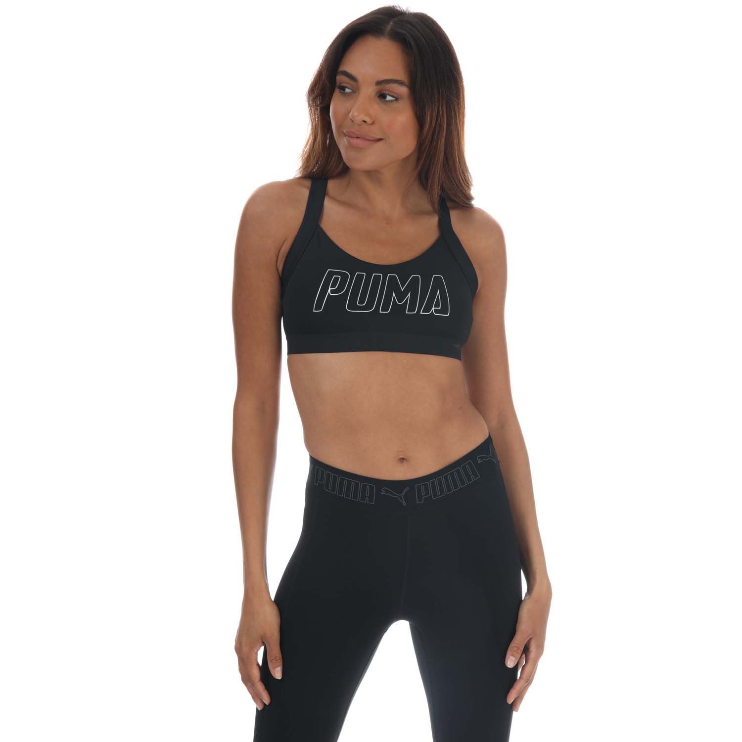 Womens Puma Training Bra in black.- Breathable spacer knit fabric adds lightweight padding and coverage.- Racerback design.- PUMA Cat Logo on back strap.- Shell: 85% Polyester  15% Elastane. Mesh: 87% Polyester  13% Elastane. Lining: 91% Polyester  9%  Elastane.- Ref: 51908501