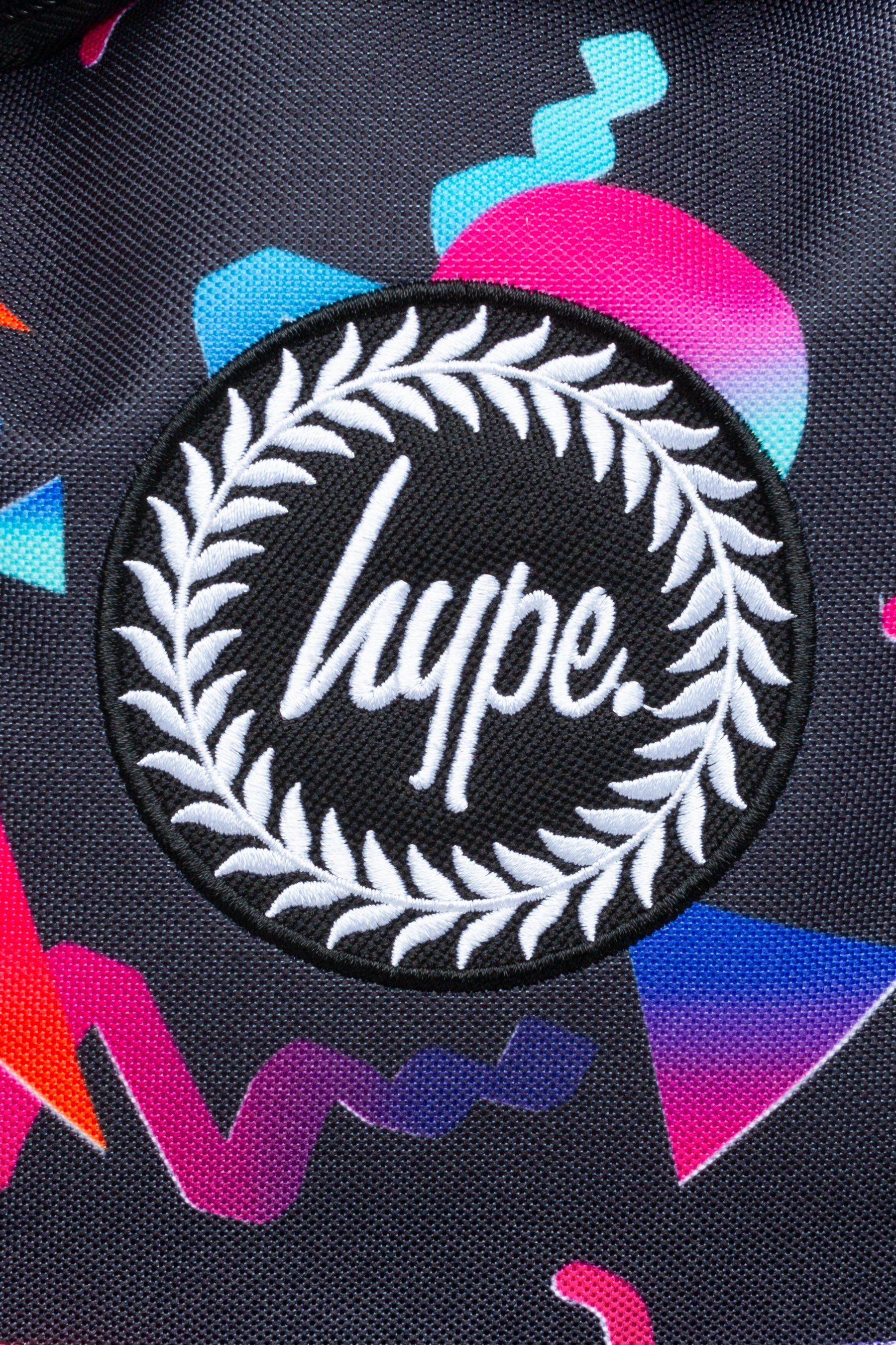 With a 90's throwback inspiration behind the bag, it's perfect to store your gym and dance kits. The HYPE. neon shapes backpack is designed with a black fabric base, with colour contrasting triangle, circle and zig-zag shapes in reds, pinks, oranges and blues. This backpack measures at 42cms x 30cms x 12cms, the right amount of room you require plus a lil' extra. The straps contain padding, creating the ultimate comfort. Wipe clean only.