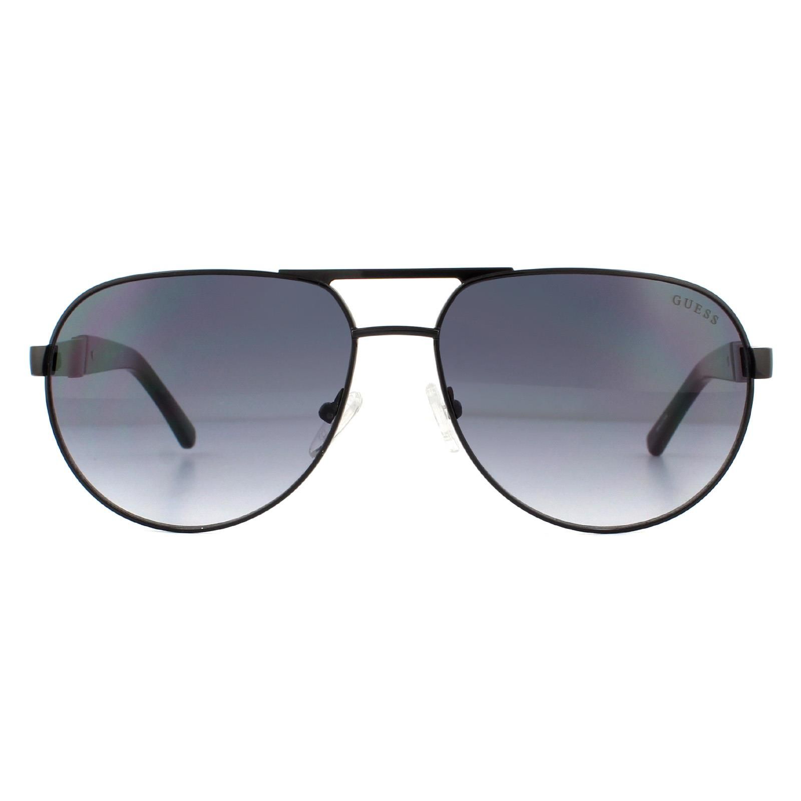 Guess Sunglasses GF5031 01B Black Grey Gradient are a stylish pilot style with a sold metal frame which then merges diagonally, halfway down the arms after the Guess logo, into plastic temple tips.