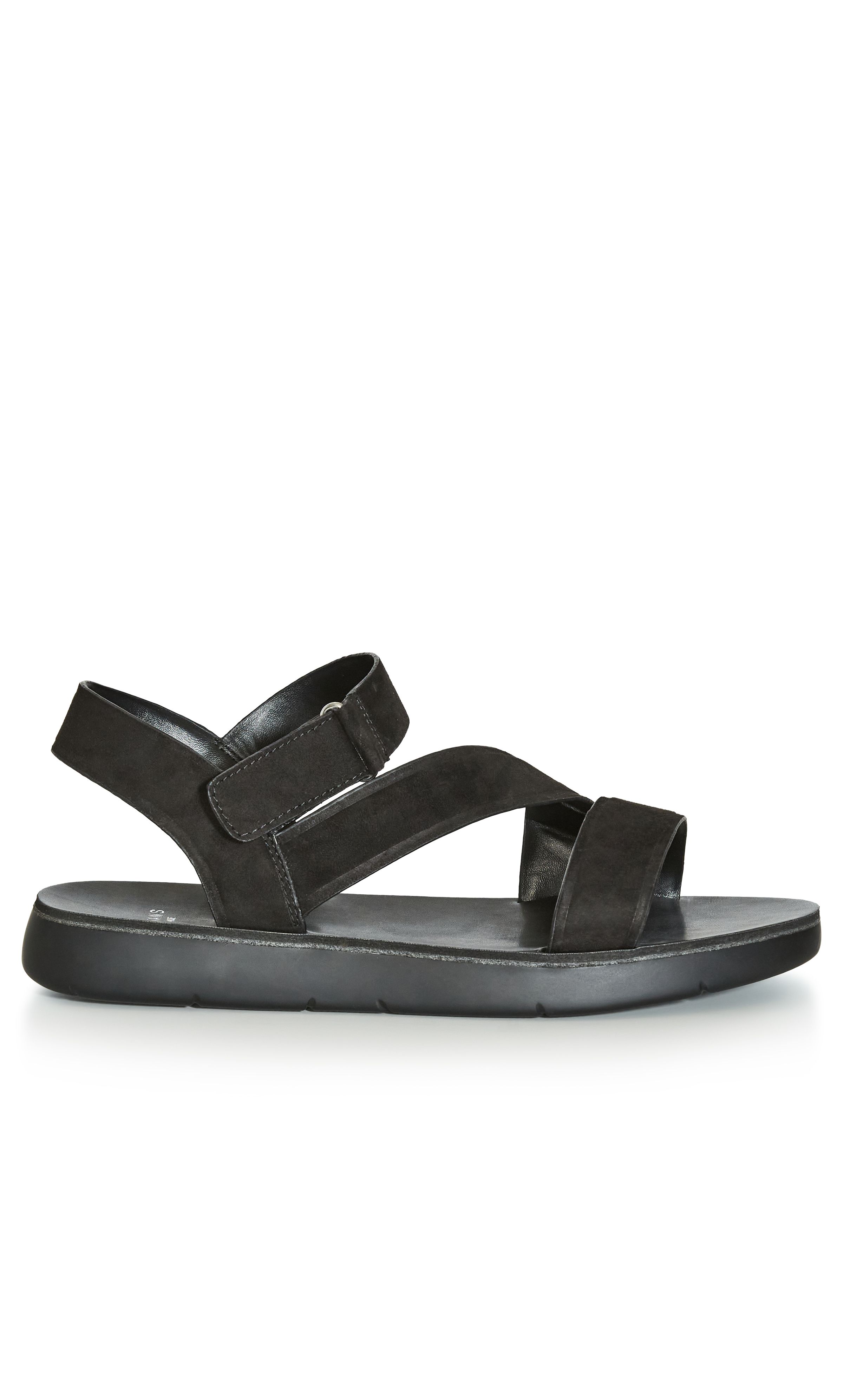 Being both seriously practical and totally trending, the Cross-Over Strap Sandal is a must-have pair for the new season! Find comfort in the chunky sole design of these everyday sandals, finished with thick straps and a faux-suede fabrication. Key Features Include: - Wide fit - Side velcro closure - Flat sole - Faux-suede fabrication Team with boyfriend jeans and a breezy cami for simple summer style.
