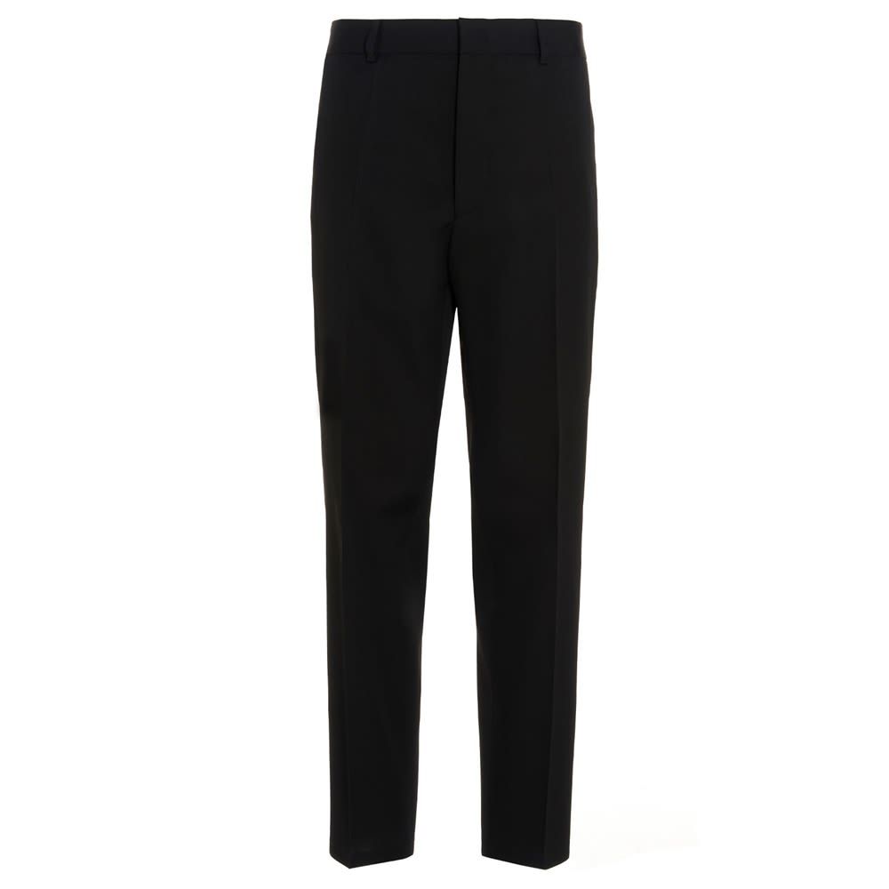 Wool trousers with a central pleat, a zip, hook-and-eye and button fastening, welt pockets, a tapered cropped leg, and a relaxed fit.