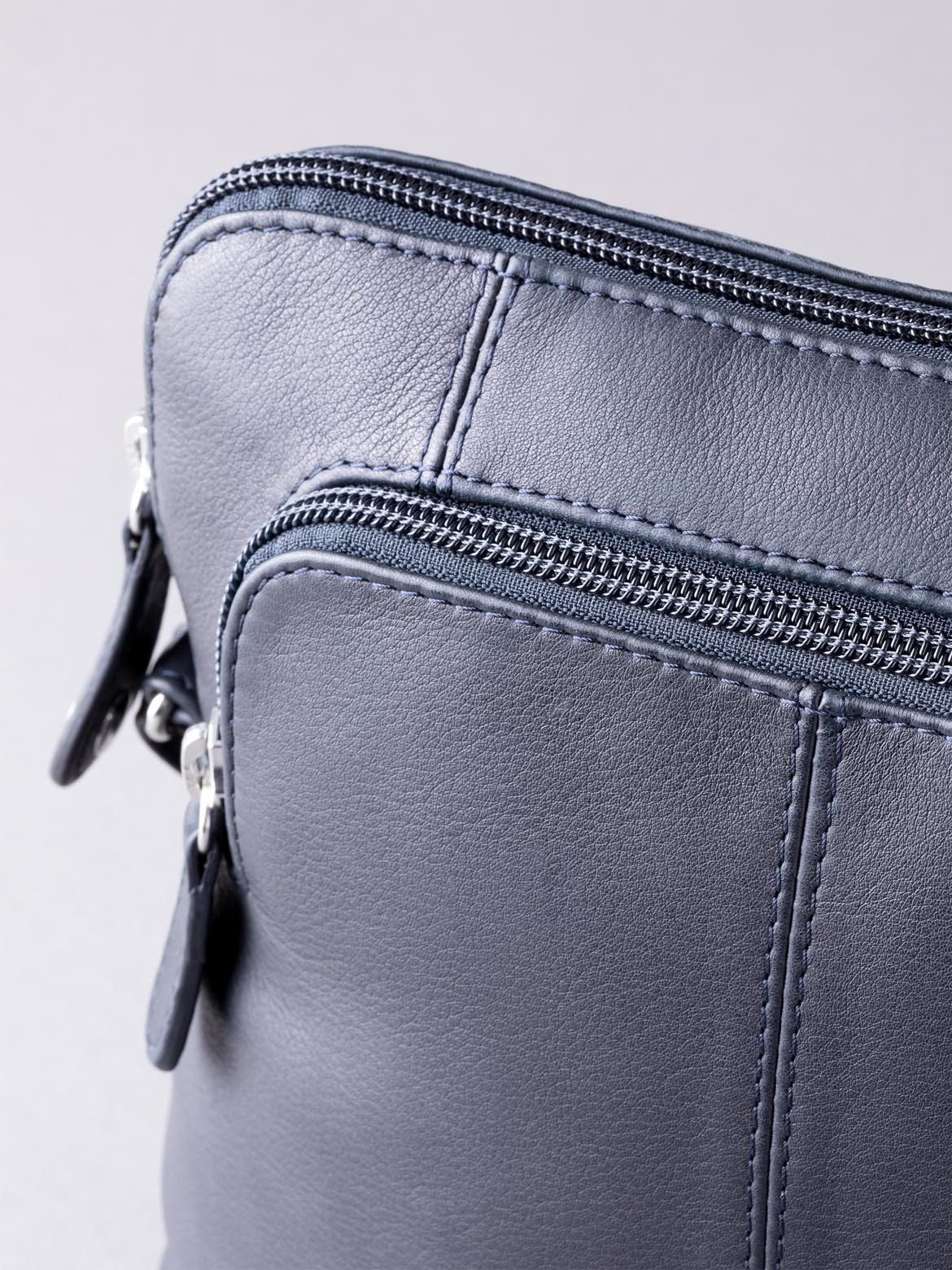 You can't argue the Raven Leather Cross Body Bag in Navy is an all-weather, all-season cross body bag. Substitute your usual handbag for this charming and functional new season update, the Raven Cross Body in Navy. Crafted using real soft quality leather, the Rachel is complete with silver tonal hardware and an adjustable strap for easy wear and styling. A versatile bag that is ideal for everyone and every day use.