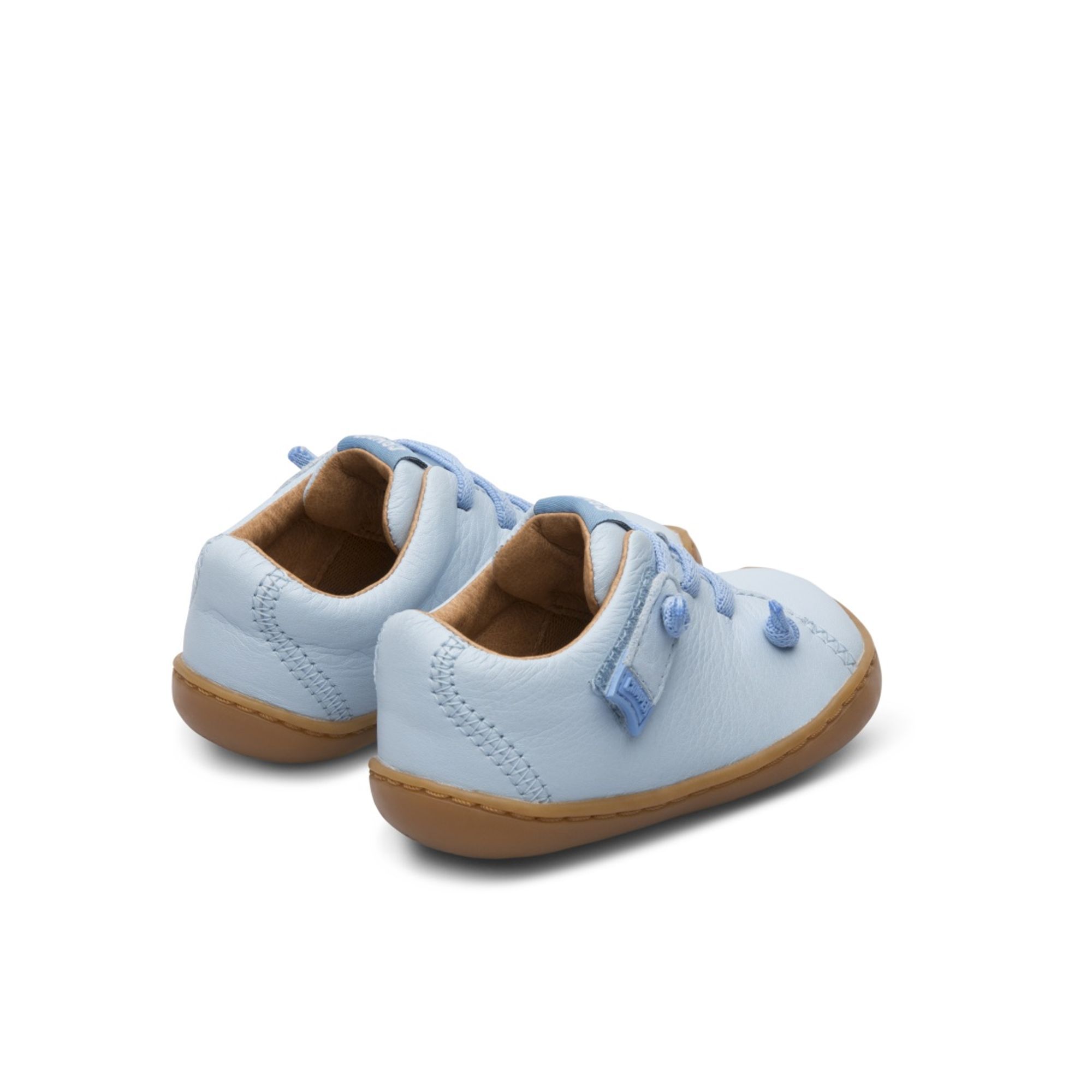 Blue shoe for kids. 100% leather upper with elastic laces and velcro. 100% brown rubber outsole.

A Little Better, Never Perfect 

The First Walkers range features flexible-yet-sturdy styles made for little ones who are taking their first steps. Discover our collection of comfortable shoes for toddlers that are designed to support those ready to embark out on their own.

Our Peu kids' shoes are shaped with the natural curve of small feet in mind. Featuring elastic zigzag laces and a 360-degree stitched outsole, these unisex shoes are made for little adventurers with ambition to explore.