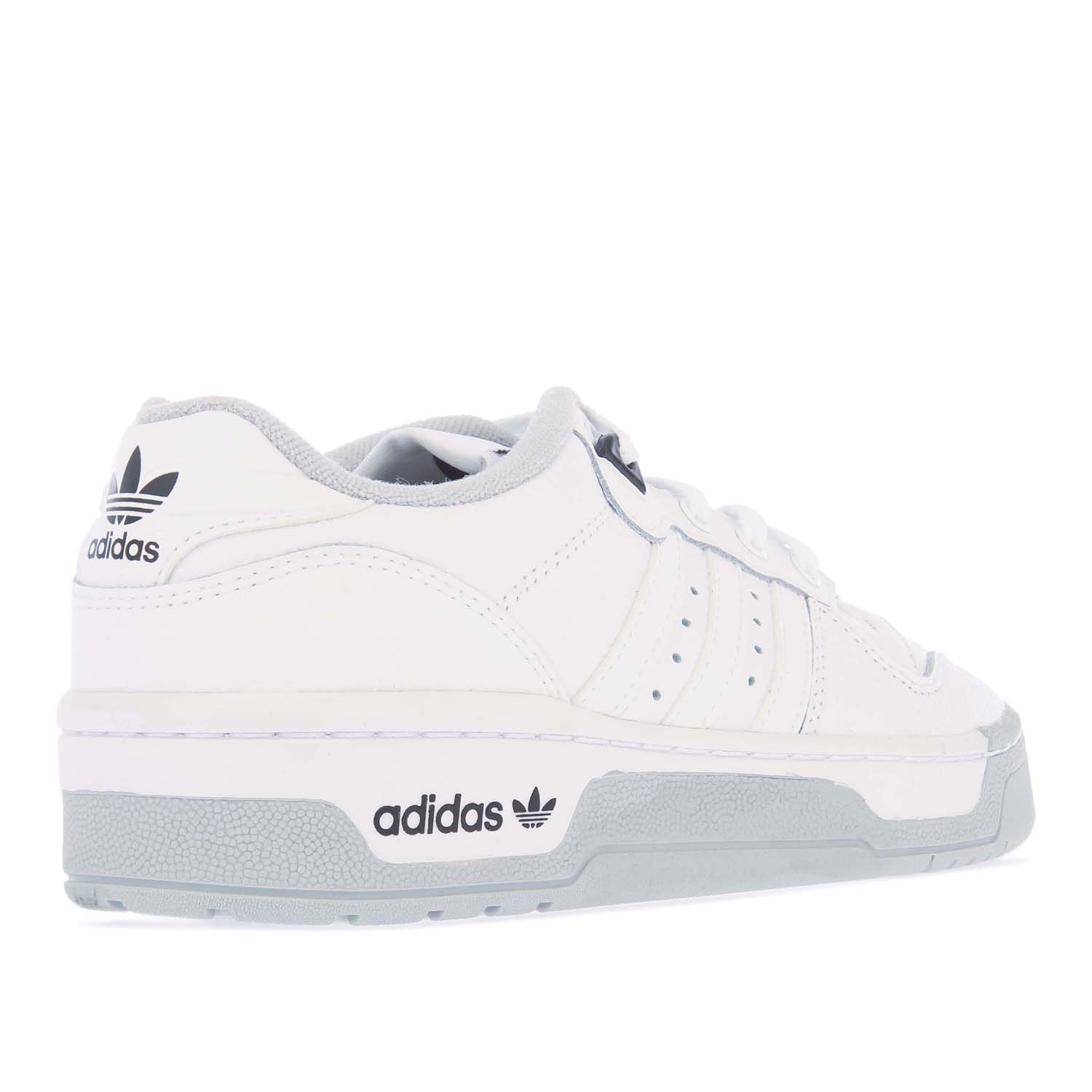 Womens adidas Rivalry Low Premium Trainers in white grey.- Leather upper. - Lace fastening.- Exposed foam tongue.- Terry towel lining.- Rubber outsole.- Leather upper  Textile lining.- Ref.: H04398