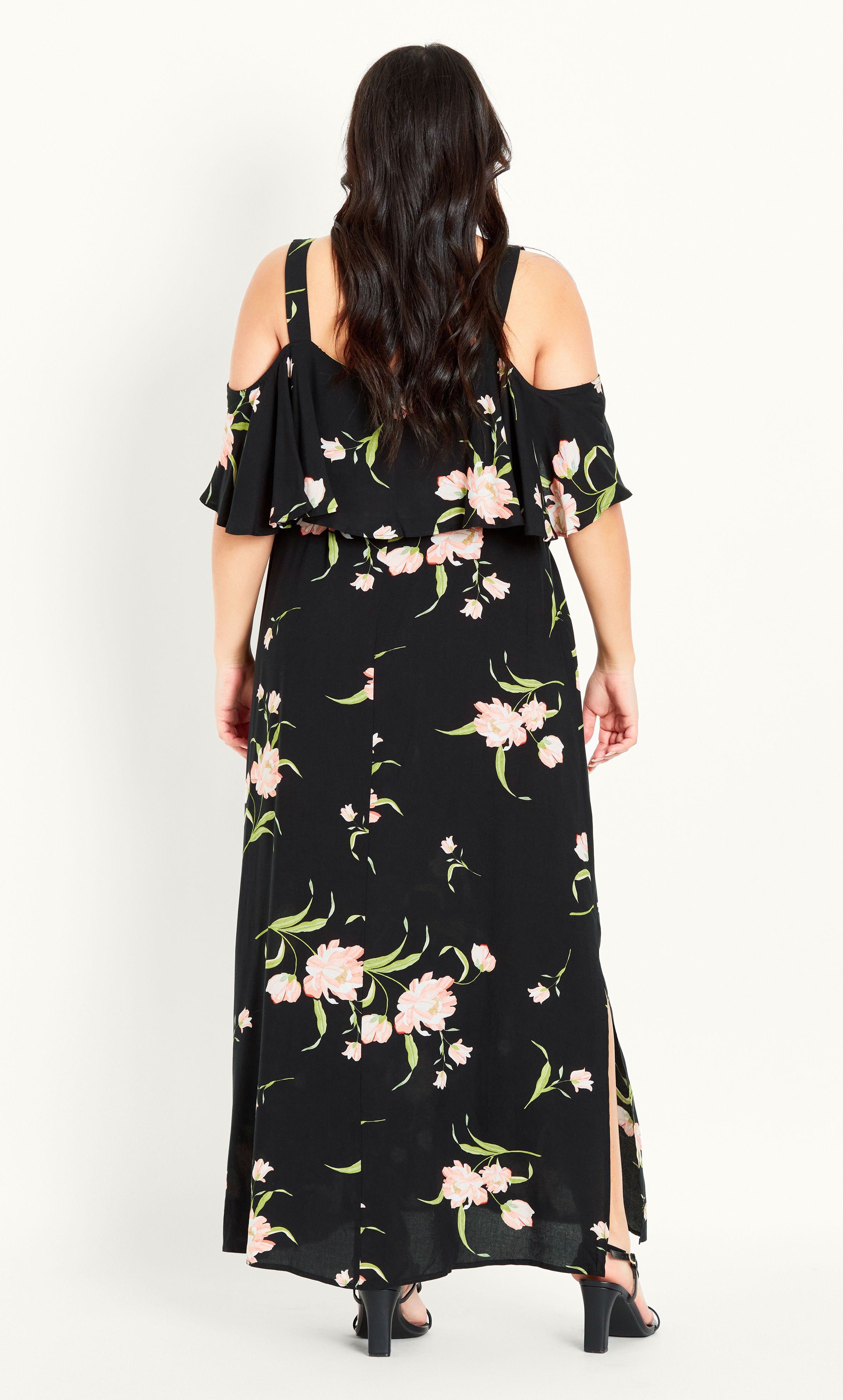 Look dreamy and feminine in our Floral Overlay Dress, offering a beautifully draped maxi hemline that floats ever so elegantly in motion. Complete with a trendy cold shoulder design, this summer dress has us dreaming of sun-soaked days ahead! Key Features Include: - V-neckline - Cold shoulder design - Elbow-length ruffle sleeve coverage - Removable self-tie waist belt - Lightweight non-stretch fabrication - Relaxed fit - Pull over style - Unlined - Maxi length - Side splits to hemline For an elevated finish, team with tassel earrings, matching heels and a bold lip.