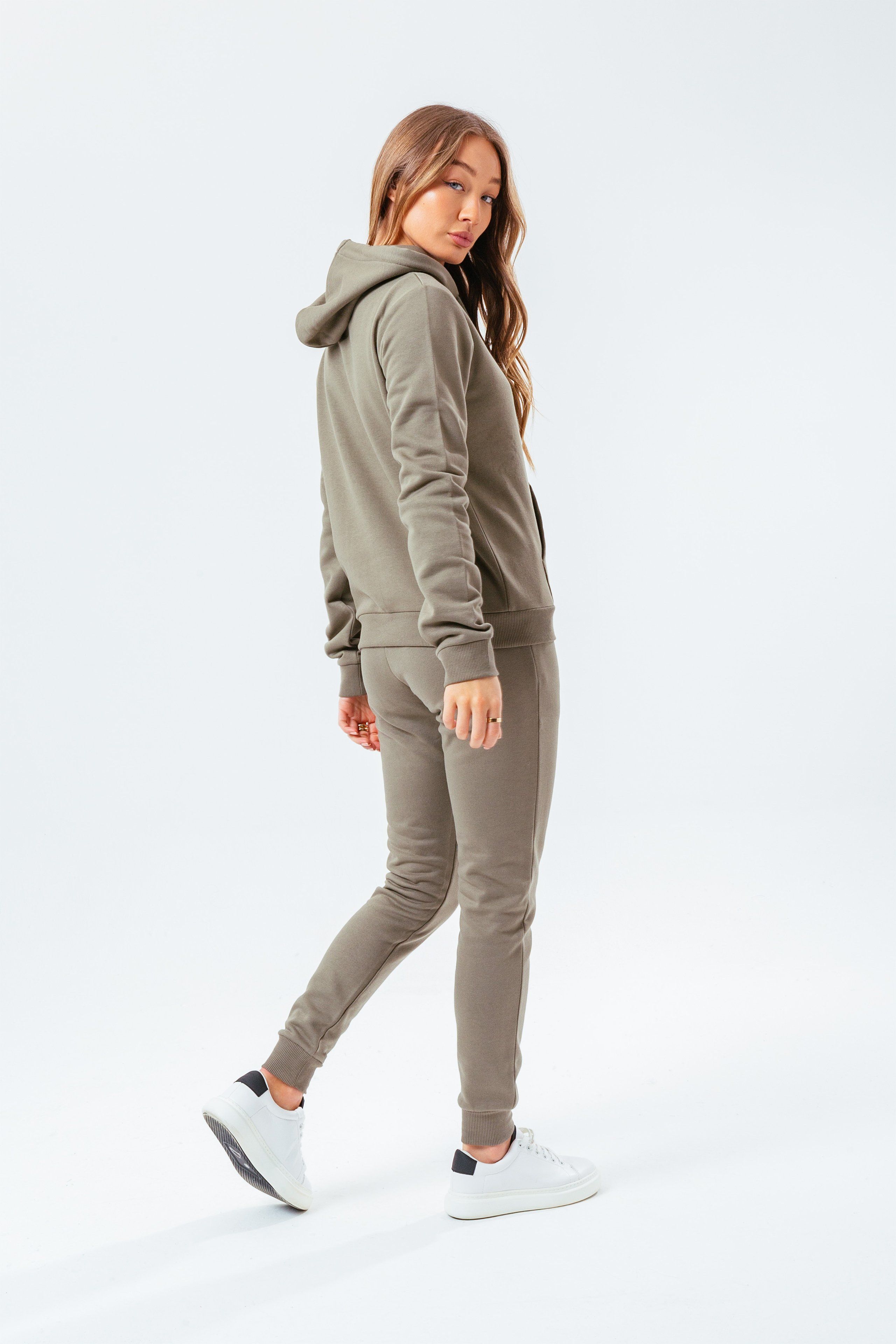The hoodie staple you need every season. The HYPE. Women's Moss Signature Hoodie. With a fixed hood, fitted cuffs, elasticated waistband and kangaroo pocket. Designed in a moss green 80% cotton and 20% polyester fabric base for the ultimate comfort and breathable space. Wear with the matching joggers to complete your next loungewear look. Machine Washable