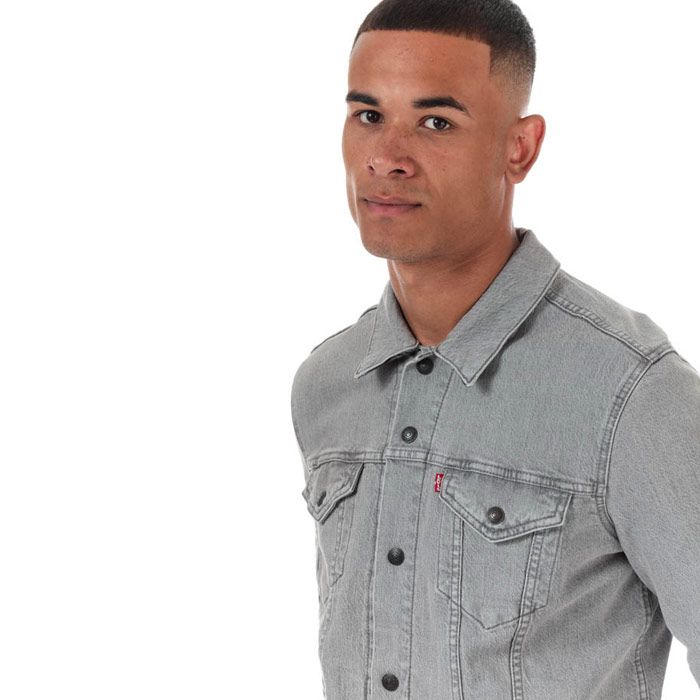 Mens Levi’s Reversible Flannel Lined Trucker Jacket in grey.<BR><BR>- Classic collar.<BR>- Full button placket with branded metal shanks.<BR>- Button cuffs.<BR>- Button-flap chest pockets.<BR>- Side hand pockets.<BR>- Back waistband tabs for an adjustable fit.<BR>- Checked flannel lining; reversible for a versatile look.<BR>- Classic fit.<BR>- Main material: 99% Cotton  1% Elastane.  Machine washable.<BR>- Ref: 85898-0000