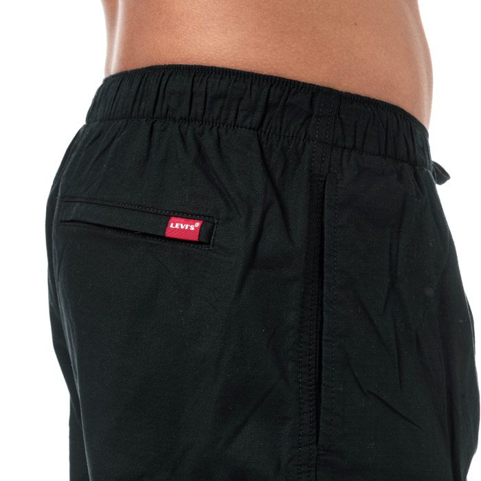 Mens Levi’s Walk Shorts in mineral black.<BR><BR>- Elasticated waist with drawcord. <BR>- Side welt pockets.<BR>- Zipped pocket at right leg.<BR>- Zipped rear pockets. <BR>- Lightweight cotton ripstop fabric with comfort stretch.<BR>- Levi’s logo tab at rear right pocket.<BR>- Sits below waist.<BR>- Regular fit.<BR>- Inside leg length measures 7in approximately.<BR>- 97% Cotton  3% Elastane. Machine washable. <BR>- Ref: 86265-0004<BR><BR>Measurements are intended for guidance only.