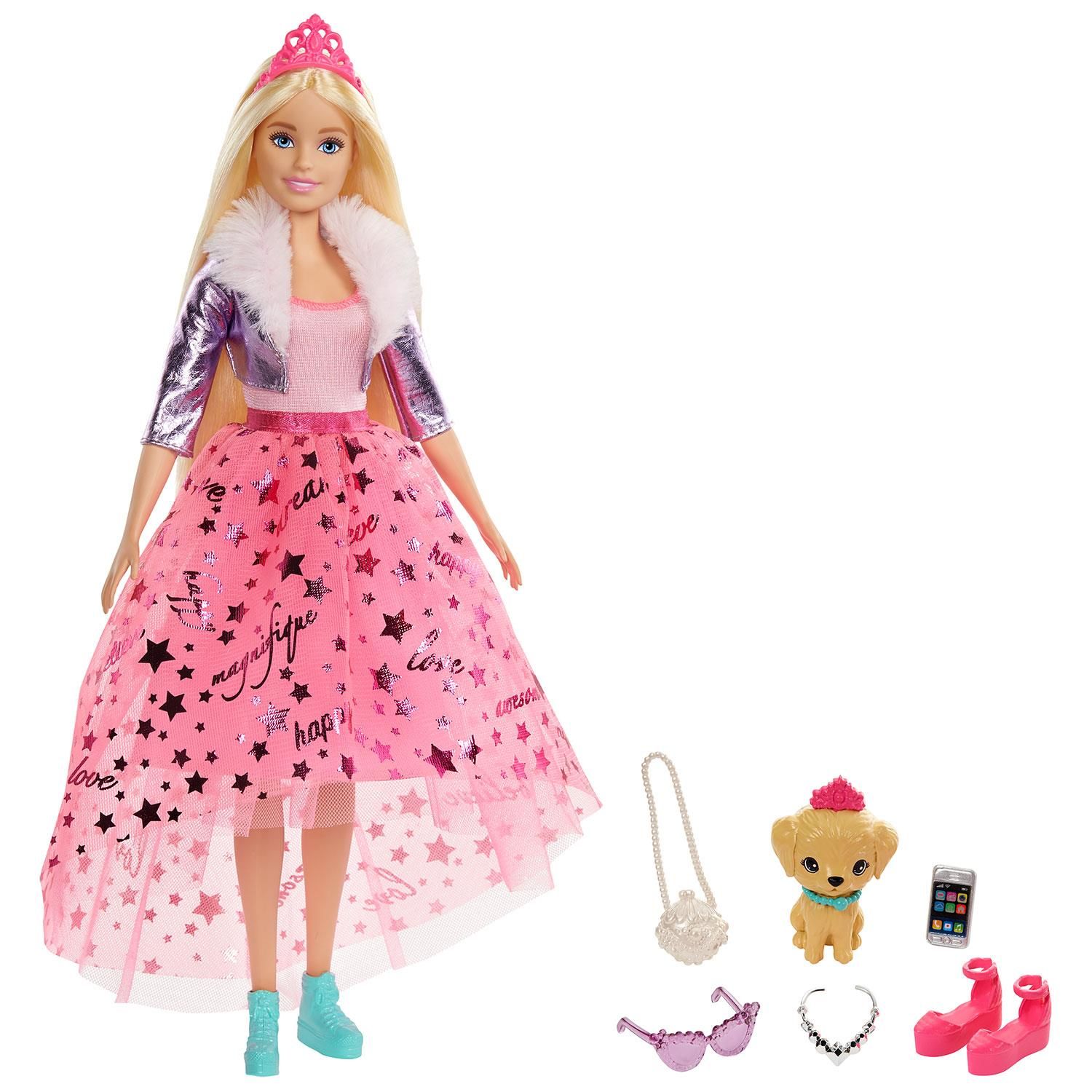 Barbie dolls inspired by Barbie Princess Adventure help transport young imaginations into lands far, far away. This Barbie doll is sporting a trendy pink top and high-low skirt as her doll outfit. The graphics on the doll shirt read “believe”, “happy”, “dream” and more. Barbie’s puppy tags along in her fashion fairy tale, with her own tiara and collar to dress up in! With Barbie Princess dolls, young dreamers will love imagining all sorts of stories to play out. These Barbie® dolls cannot stand alone. Colors and decorations may vary.

The Barbie Princess Adventure dolls and playsets take little imagination to faraway lands.
The Barbie doll comes dressed as a princess in a sparkly skirt, metallic jacket, and bright blue high tops!
Doll accessories include a pink tiara, sandals, purses, sunglasses, necklaces, and a smartphone.
This Barbie princess doll comes with a royal puppy friend with her own tiara and collar, keeping with the fantasy look!
Kids can collect more Barbie® Princess Adventure™ dolls and toys to create even more fantastical stories.
These Barbie playsets and dolls make great gifts for kids aged 3 and up.

Box Contains: 1x Barbie® Princess Adventure Doll with Puppy Toy