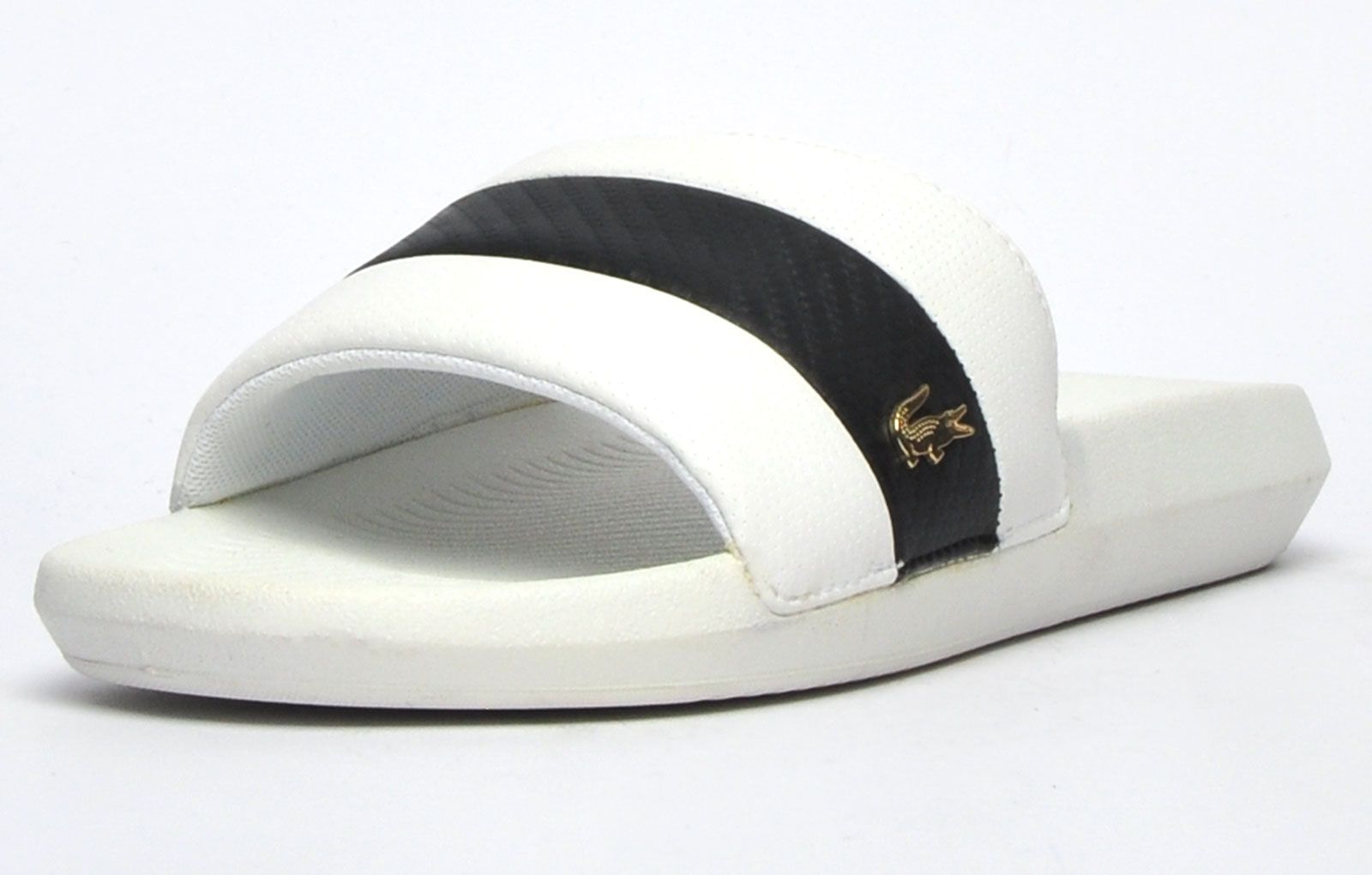 Step into on trend summer style with these mensCroco Slides from Lacoste. In a classic colourway, these designer sandals are delivered in a smooth synthetic upper with band stripe detailing across the forefoot foot strap. The super comfy moulded footbed delivers the perfect fit and feel while the grippy outsole will keep you sure and safe around the pool or in the shower. These designer slides are finished with eye catching Lacoste branding throughout just in case you want a sign of approval that youre wearing cool on trend style this summer season 
 
 - Synthetic comfort upper
 - Comfort moulded footbed
 - Single strap construction
 - Grippy outsole
 - Slip on wear
 - Iconic Lacoste branding throughout
 Please Note: These slides are supplied poly bagged (without box)
 These Lacoste Slides are sold as B grades which means there may be some very slight cosmetic issues on the shoe and they come in a poly bag. There could be occasional issues with wrong swing tags being allocated to wrong shoes by Lacoste themselves which could result in some size confusion but you must take the size IN THE SHOE as the size that the shoe actually is ( not what is on the tag ). We have checked most of the shoes and in our opinion,all are practically perfect without any blemishes on them at all and in essence if the shoes did not have the letter B denoted on the swing tag you would presume these were perfect shoes. All shoes are guaranteed against fair wear and tear and offer a substantial saving against the normal high street price. The overall function or performance of the shoe will not be affected by any minor cosmetic issues. B Grades are original authentic products released by the brand manufacturer with their approval at greatly reduced prices. If you are unhappy with your purchase, we will be more than happy to take the shoes back from you and issue a full refund