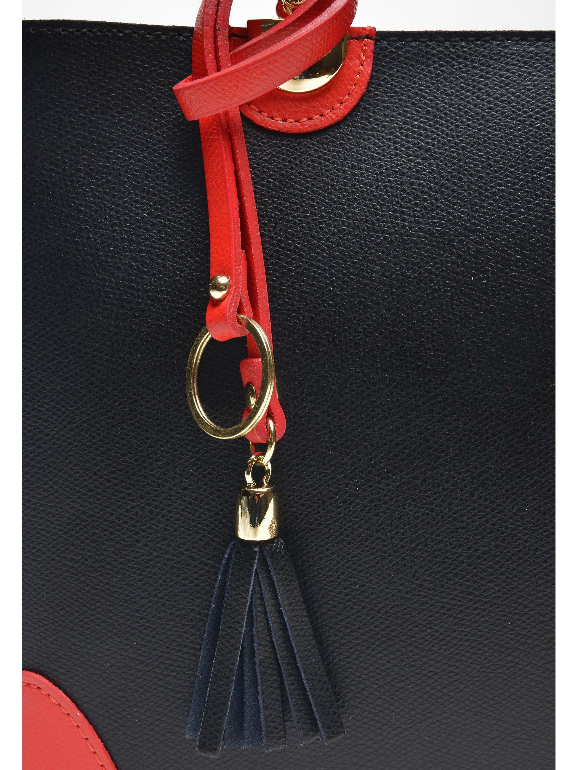 Top Handle Bag
100% cow leather
Two top handles: 36 cm 
Interior zip organizing pocket
Tassel accent on front
Detachable shoulder strap
Dimensions: 23.5x36x12 cm