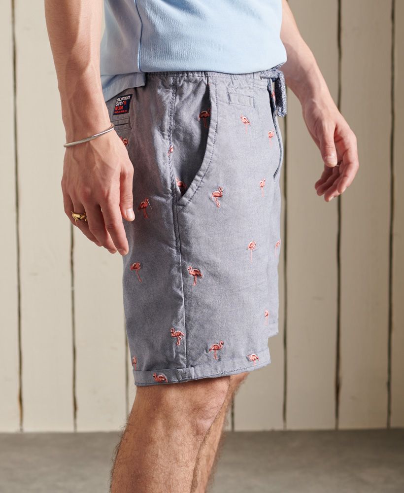 A classic short with a twist. These shorts feature a classic five pocket design and an all over embroidered pattern. Pair with a vest top and sliders for a beach ready look.Button and zip fly fasteningDrawstring elasticated waistFive pocket designSignature logo patchAll over flamingo embroidered design
