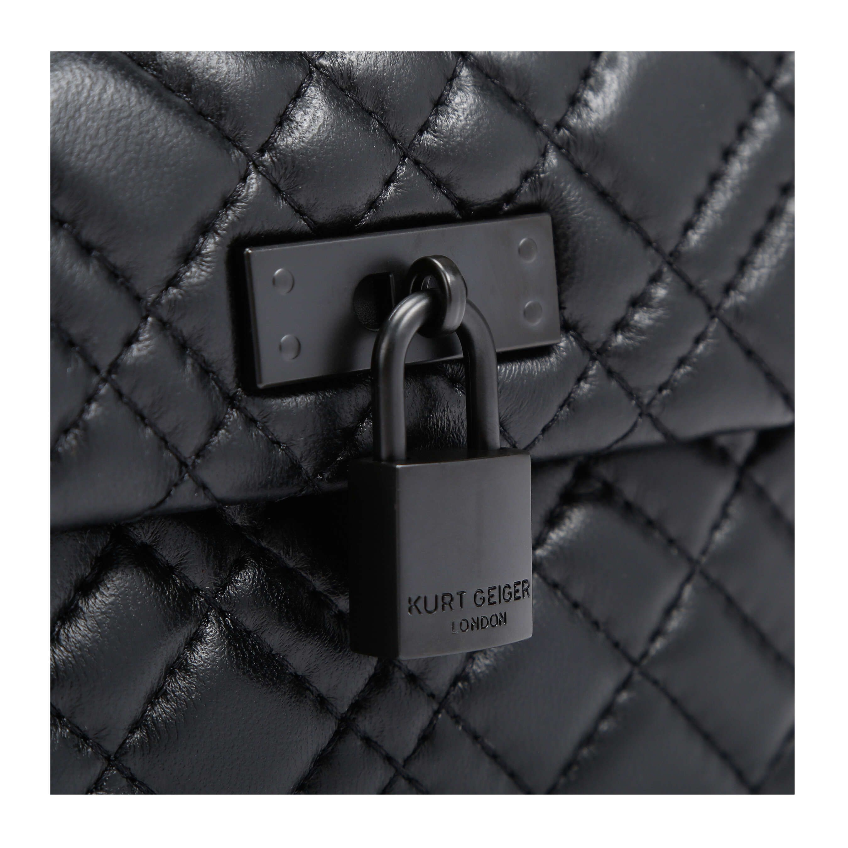 The KGL Mini Brixton Lock Bag is crafted in a black leather with overstitch quilting. The black metal branded padlock sits on the flap. 14cm (H), 20cm (L), 6cm (D). Strap drop cross body: 120cm. Strap drop shoulder: 70cm.