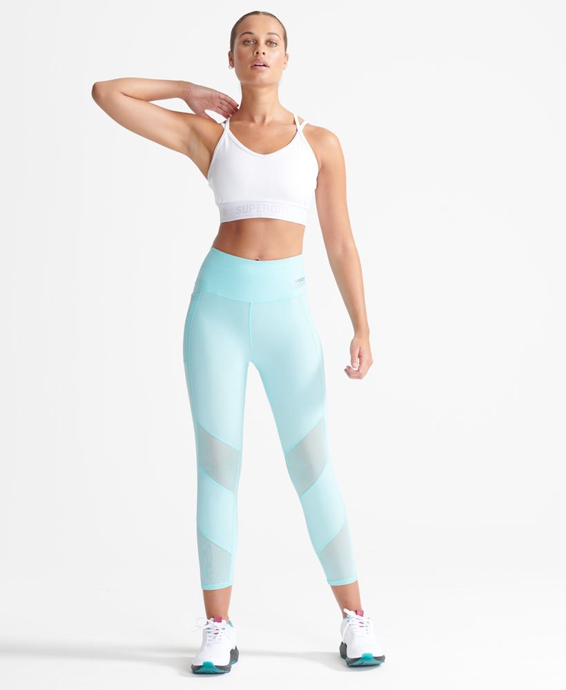 Superdry women's cooling Capri leggings. Stay cool in these Capri cooling leggings featuring mesh panelling to the legs to allow heat to escape, a zip back pocket, mesh phone sleeve and drawstring elasticated waist. finished with Superdry Sport branding to the waistband.Fitted: A body-sculpting fit, tight to the body