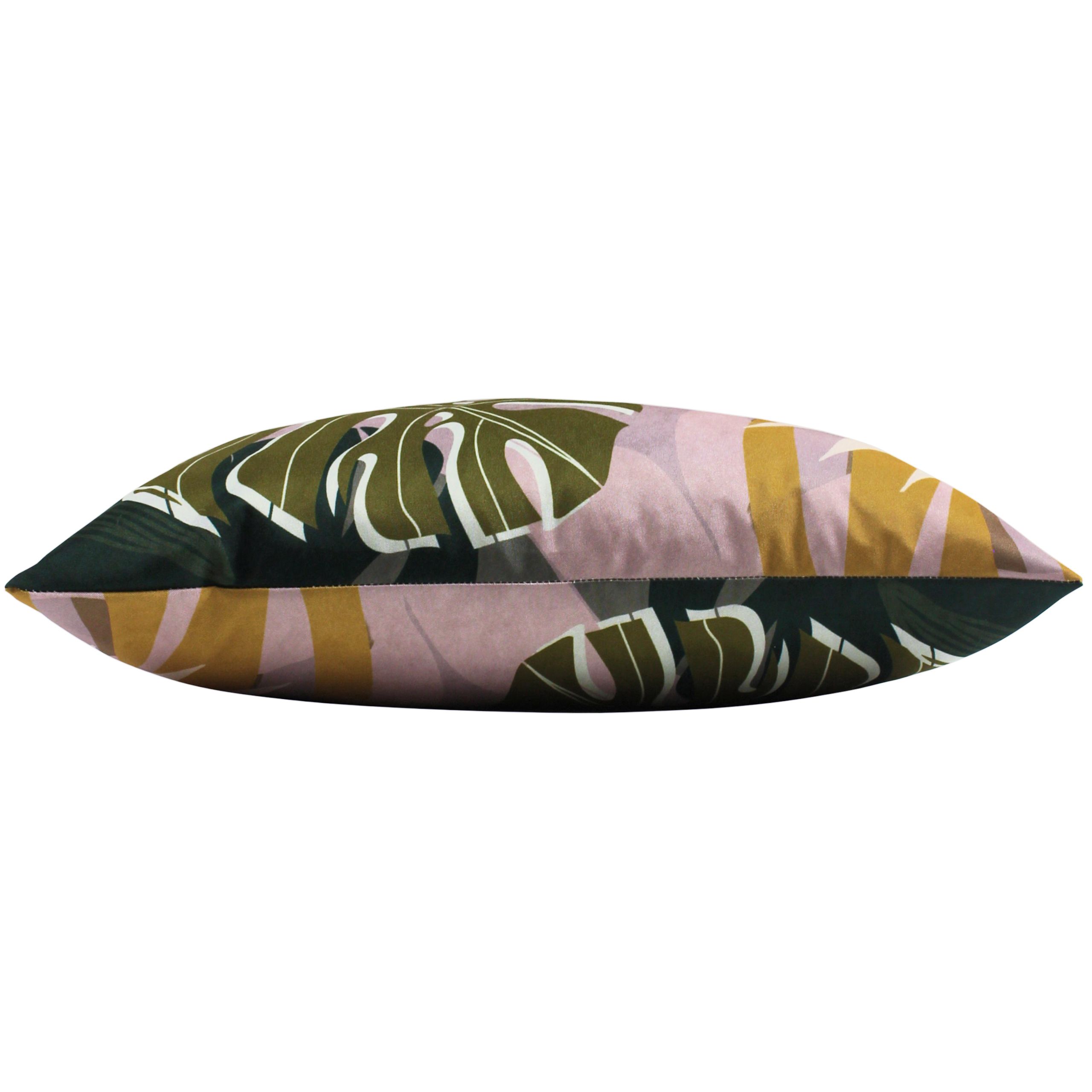 Featuring a bold and abstract design of palm leaves. This fully reversible design in muted blush pinks and olive green's will instantly freshen up your outdoor space.