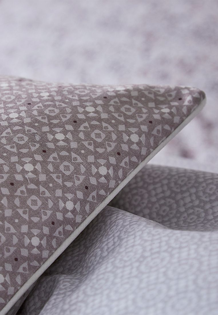Layer the bed with a beautiful tile design cushion. Fibre Filled, Made in China.