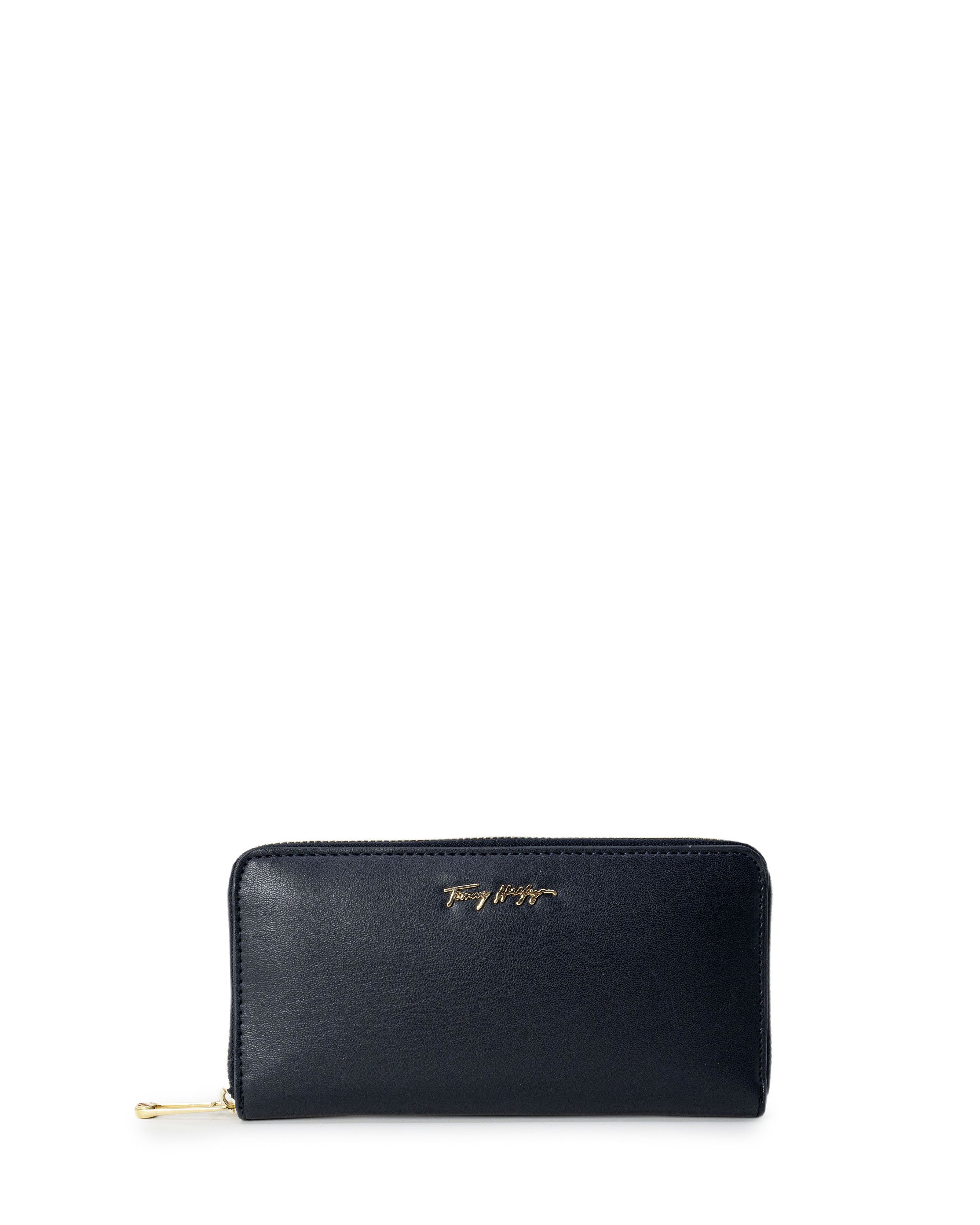 Brand: Tommy Hilfiger Gender: Women Type: Wallets Season: Spring/Summer  PRODUCT DETAIL • Color: black • Pattern: plain • Fastening: with zip • Size (cm): 10.5x17x3.5 cm  COMPOSITION AND MATERIAL • Composition: -100%  polyurethane