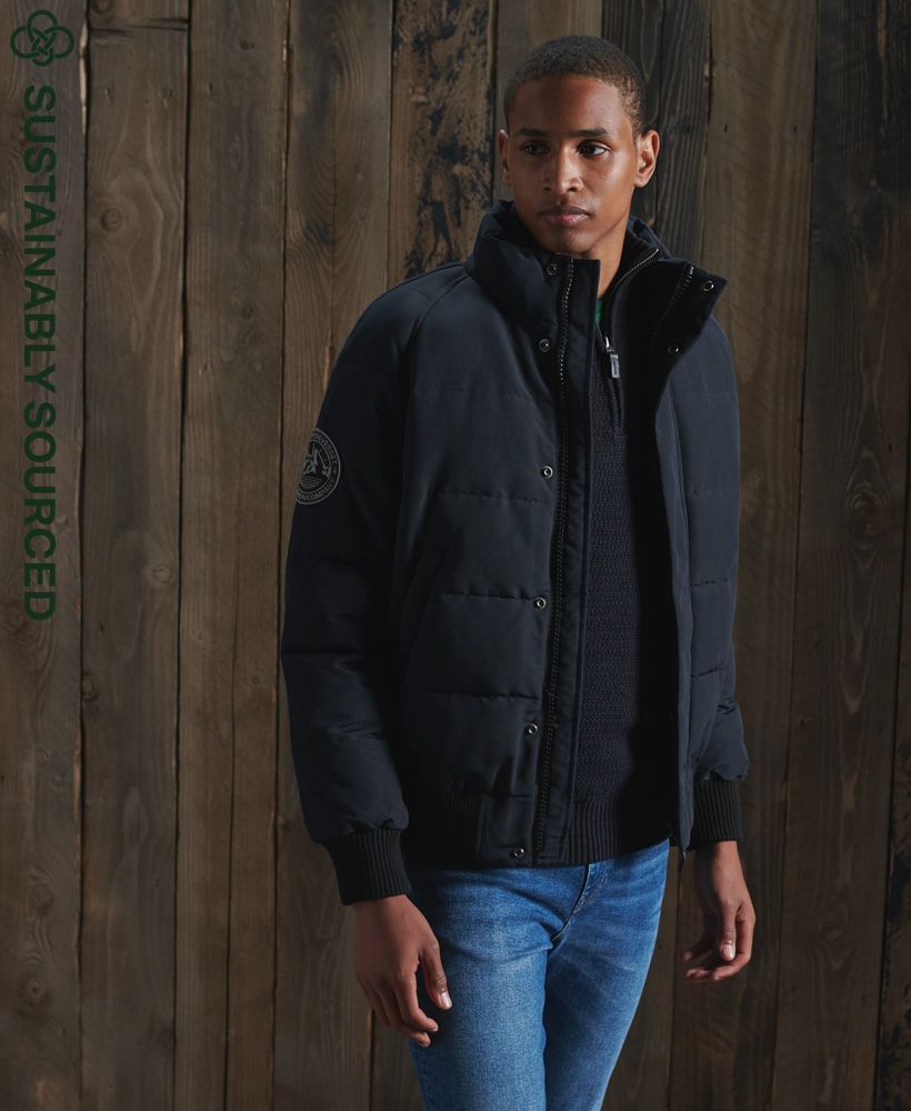 Everyone loves a versatile bomber, so we introduce to you the Everest Non Hooded Bomber Jacket, featuring a zip and popper fastening, ribbed cuffs and recycled polyester filling.Zip and popper fasteningRibbed cuffs and hemTwo front popper pocketsRecycled polyester paddingSignature logo patchThe padding in this jacket is 100% Recycled Polyester – each jacket contains up to 10 recycled bottles, this avoids these bottles being sent to landfill or polluting our oceans.
