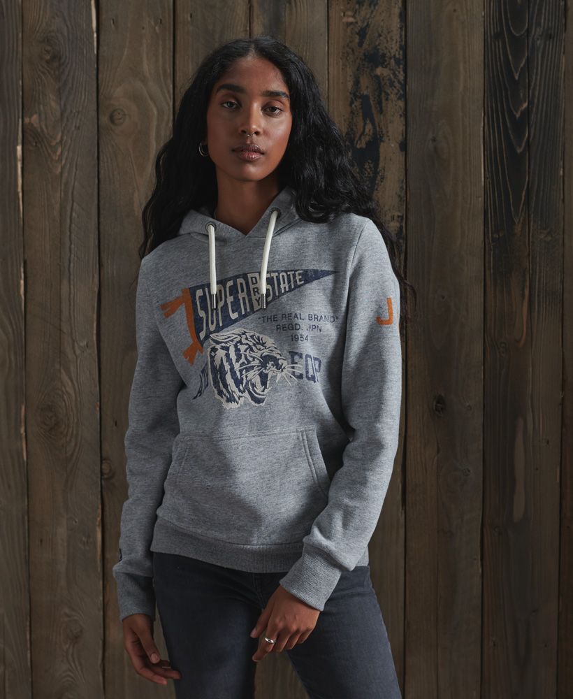 Inspired by athleisure attire, the Track & Field classic hoodie is perfect for layering up to provide you with an extra layer of warmth this season with a super-soft fleece lining.Slim fit – designed to fit closer to the body for a more tailored lookDrawstring hoodLong sleevesRibbed cuffs and hemFleece liningCrack effect detailingSuperdry logo graphicSignature logo tab