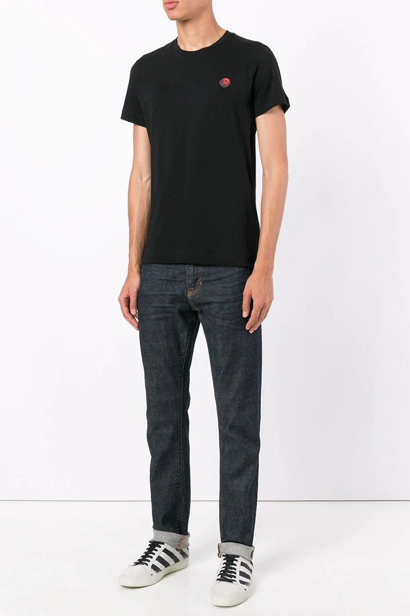 Brand: Diesel
 Gender: Men
 Type: T-shirts
 Season: Spring/Summer
  PRODUCT DETAIL
 • Color: black
 • Pattern: plain
 • Fastening: slip on
 • Sleeves: short
 • Neckline: round neck
  COMPOSITION AND MATERIAL
 • Composition: -100% cotton 
 •  Washing: machine wash at 30°. print:plain. neckline:roundneck. sleeves:short-sleeve. collar:collar