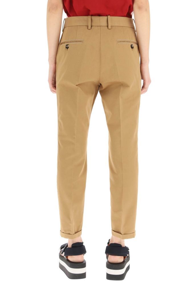 Marni trousers in organic cotton and linen drill, finished with contrast topstitching. Slim fit, side slanted pockets, back bound pockets with button, concealed zip and hook closure, cuffed leg. The model is 177 cm tall and wears a size IT 38.