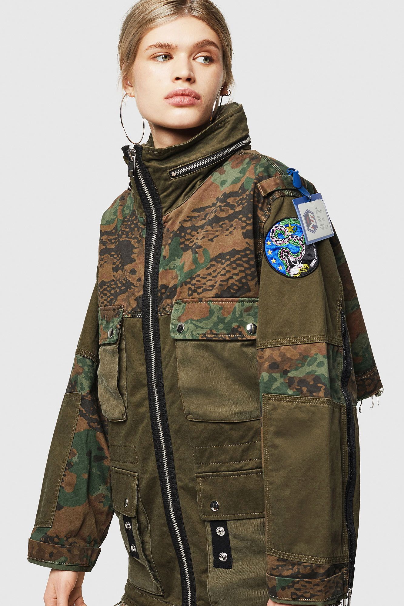 Brand: Diesel
Gender: Women
Type: Jackets
Season: All seasons

PRODUCT DETAIL
• Color: green
• Pattern: camouflage
• Fastening: with zip
• Sleeves: long
• Collar: hood
• Pockets: front pockets

COMPOSITION AND MATERIAL
• Composition: -100% cotton 
•  Washing: machine wash at 30°