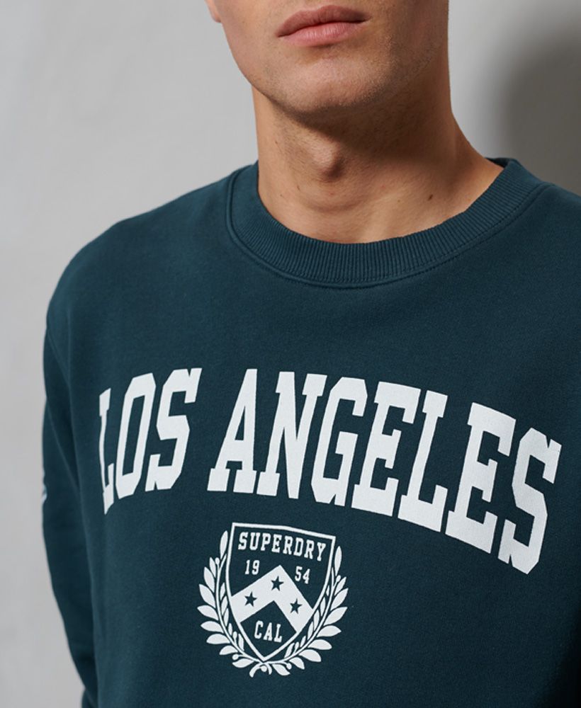 Get the ultimate collegiate look with the City College Oversized Sweatshirt, featuring a super soft lining and a college inspired print.Oversized fit – exaggerated and super relaxed, let your style flowLong sleevesCrew necklineRibbed cuffs and hemPrinted graphicEmbroidered logoSignature logo patch