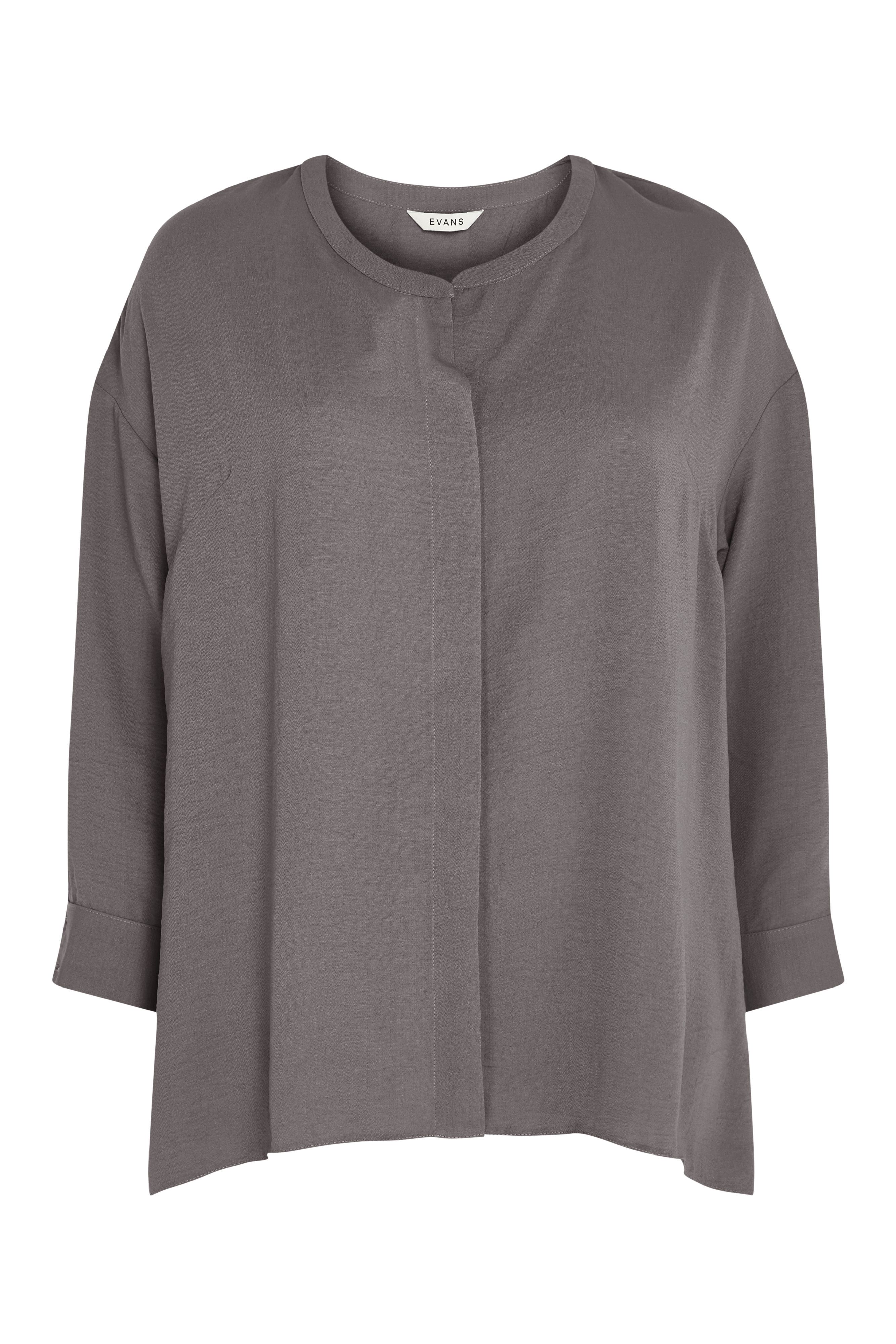 Beautifully soft and flattering as ever, the Relaxed Hi Lo Shirt makes a staple addition to any wardrobe. Flaunting a concealed button down front and contemporary collarless neckline, this shirt is bound to become your everyday go-to! Key Features Include: - Round neckline - Collarless - Concealed button down front - Long sleeves - Relaxed fit - Curved hemline - Hip length Team with distressed denim, chunky trainers and a roomy tote for weekend styling perfection.