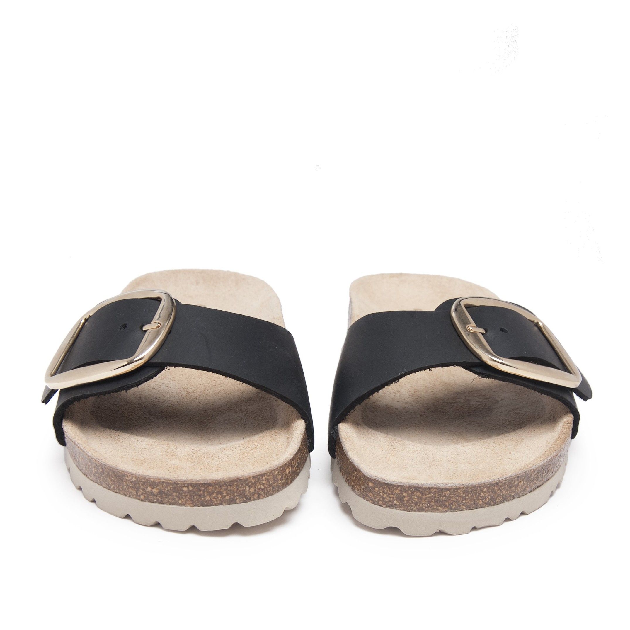 Bio sandal with a leather front buckle. Adjustable metal buckle. Exterior and interior made of leather. Platform: 1 cm. Sole: EVA. This product is manufactured in Spain.