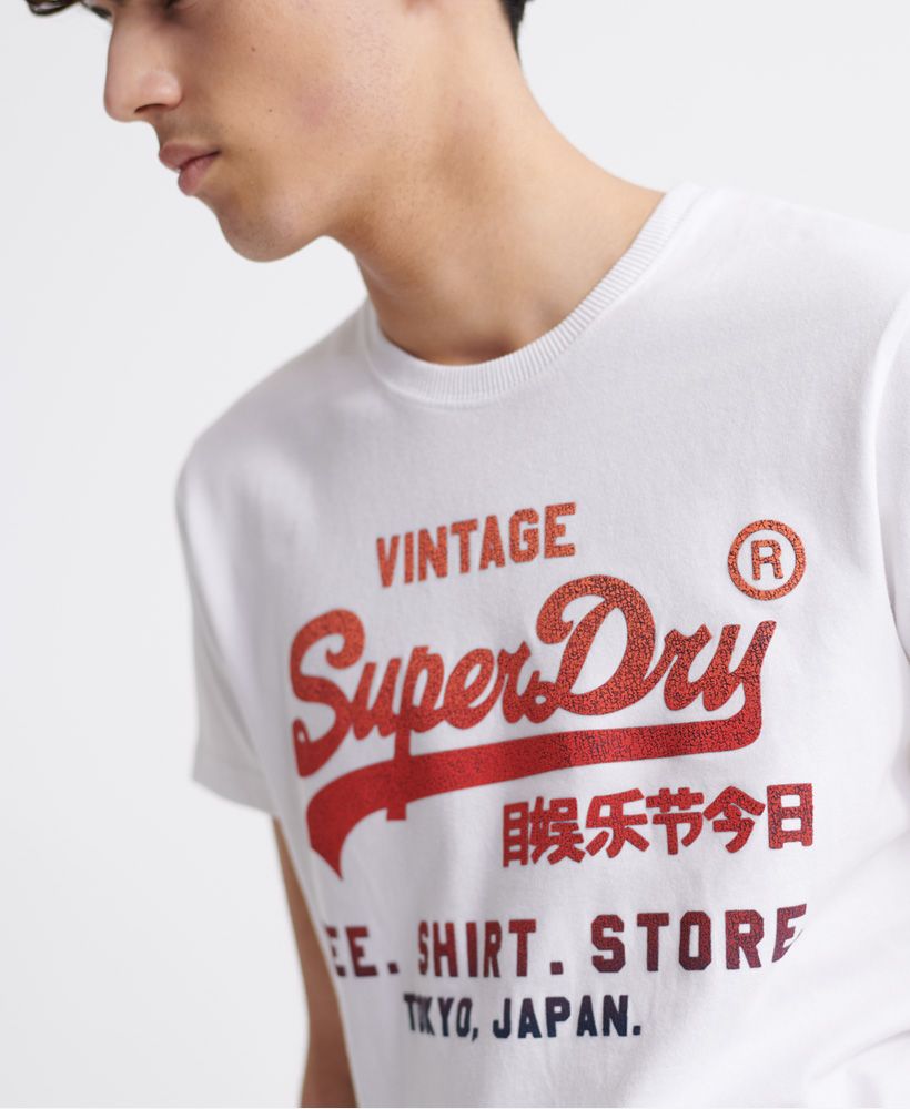 Superdry men's Vintage Logo fade t-shirt. This classic tee features a ribbed crew neck, short sleeves and a textured cracked effect Superdry logo across the chest. Pair with your favourite jeans to complete the look this season.Slim fit