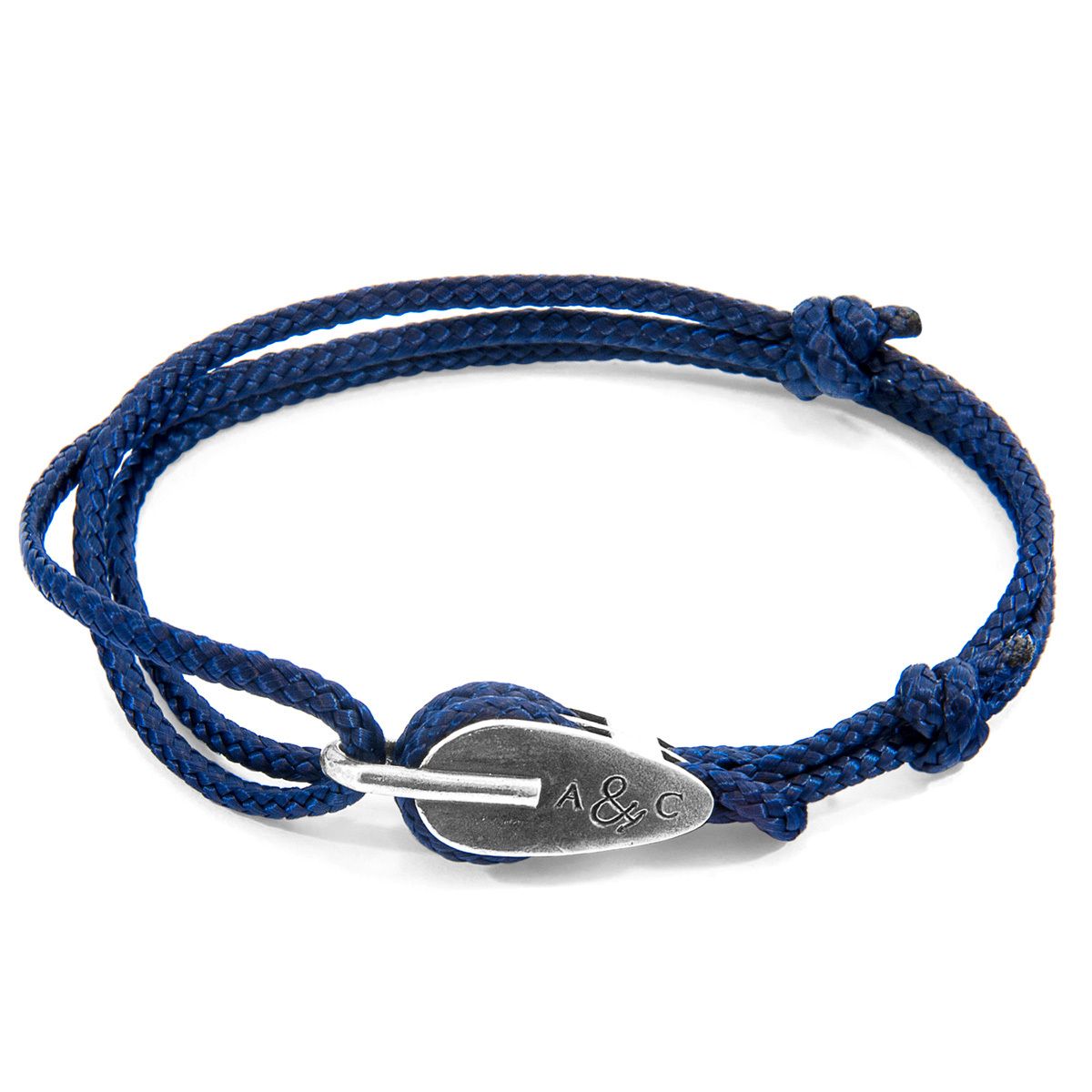 The Tyne Silver and Rope Bracelet was both designed and skilfully handcrafted completely in Great Britain, In Quality We Trust. For the Modern Journeyman (and woman), ANCHOR & CREW takes ownership of an exploratory lifestyle and enjoys the Happy-Good Life. Combining British craft manufacturing with a discerning modern-minimalist style, this ANCHOR & CREW bracelet features:

3mm diameter performance Marine Grade polyester and nylon rope (GB) 
Secure solid .925 sterling silver oversized pulley (GB) 

This bracelet is one size fits all, with the rope able to extend or tighten to suit your wrist size. To take the bracelet on or off your wrist, simply slide the one adjustable knot around the rope to make the loop size smaller or larger. The rope adjusts itself by feeding freely through the large bar of the pulley clasp.