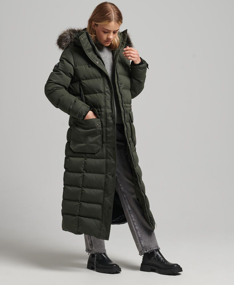 Warm up in style this winter with the Microfibre Expedition Longline Parka coat. Taking the classic parka design and making it longer and more luxurious has made this coat more distinctive, giving your winter wardrobe that added personal duvet lift. Casual, crafted and definitely functional, the Expedition longline parka will be the one you turn to.Relaxed fit – the classic Superdry fit. Not too slim, not too loose, just right. Go for your normal sizeUK10 shoulder to hem: 125cmLong-line quilted designRemovable hoodDetachable faux fur hood trimAdjustable hoodDrawstring hoodBungee cord hemTwo-way zip and popper fasteningFour-pocket designPopper cuffs with ribbed insertsTwo sleeve pocketsSignature logo badgeFully linedBungee cord waist adjusterInner mesh pocketInner zipped pocketThe padding in this jacket is 100% recycled, each jacket contains up to 30 recycled bottles, this avoids these bottles being sent to landfill or polluting our oceans.
