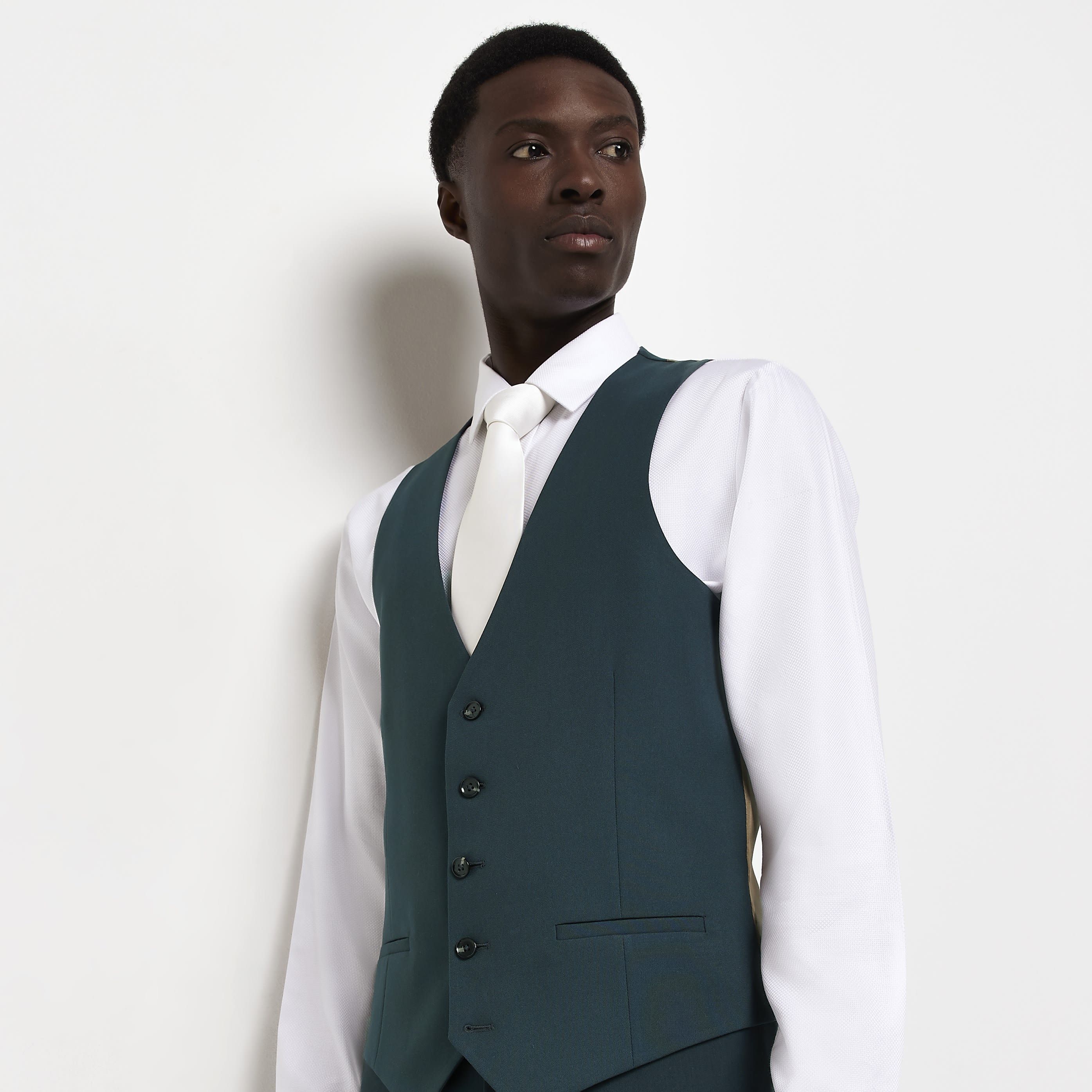 > Brand: River Island> Department: Men> Colour: Green> Type: Suit Waistcoat> Material Composition: 64% Polyester 34% Viscose 2% Elastane> Material: Polyester> Pattern: No Pattern> Occasion: Formal> Size Type: Regular> Closure: Button> Season: SS22