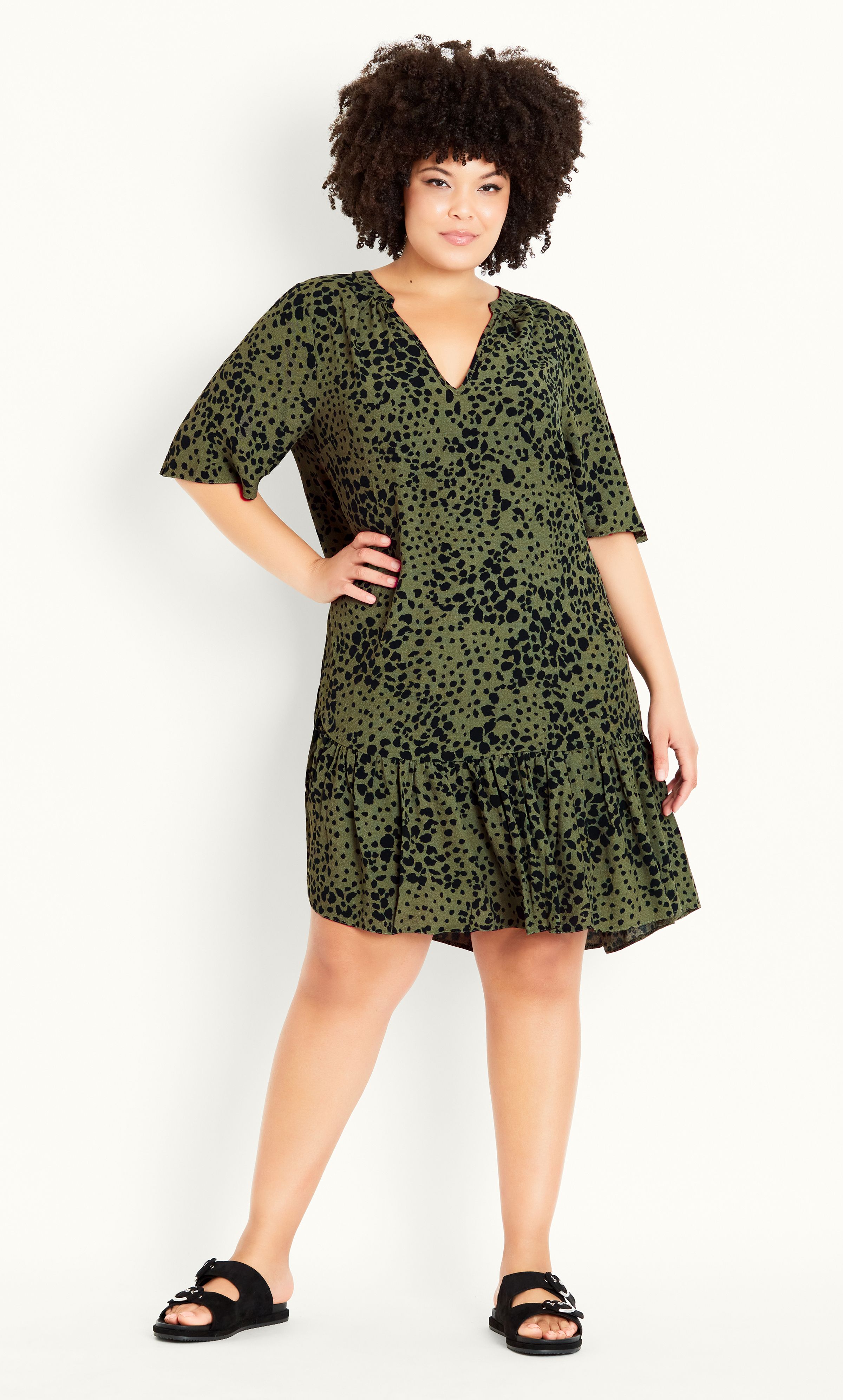 Bring a touch of fun-loving print to your wardrobe with our breezy Animal Dress. Perfect for a sun-soaked summer day, this dress offers a notched V-neckline, short sleeves and lightweight fabrication. Key Features Include: - Notched V-neckline - Elbow-length sleeves - Relaxed fit - Unlined - Lightweight non-stretch fabrication - Pull over style - Frilled hemline Team with woven slides and a sleek waist belt for shape.