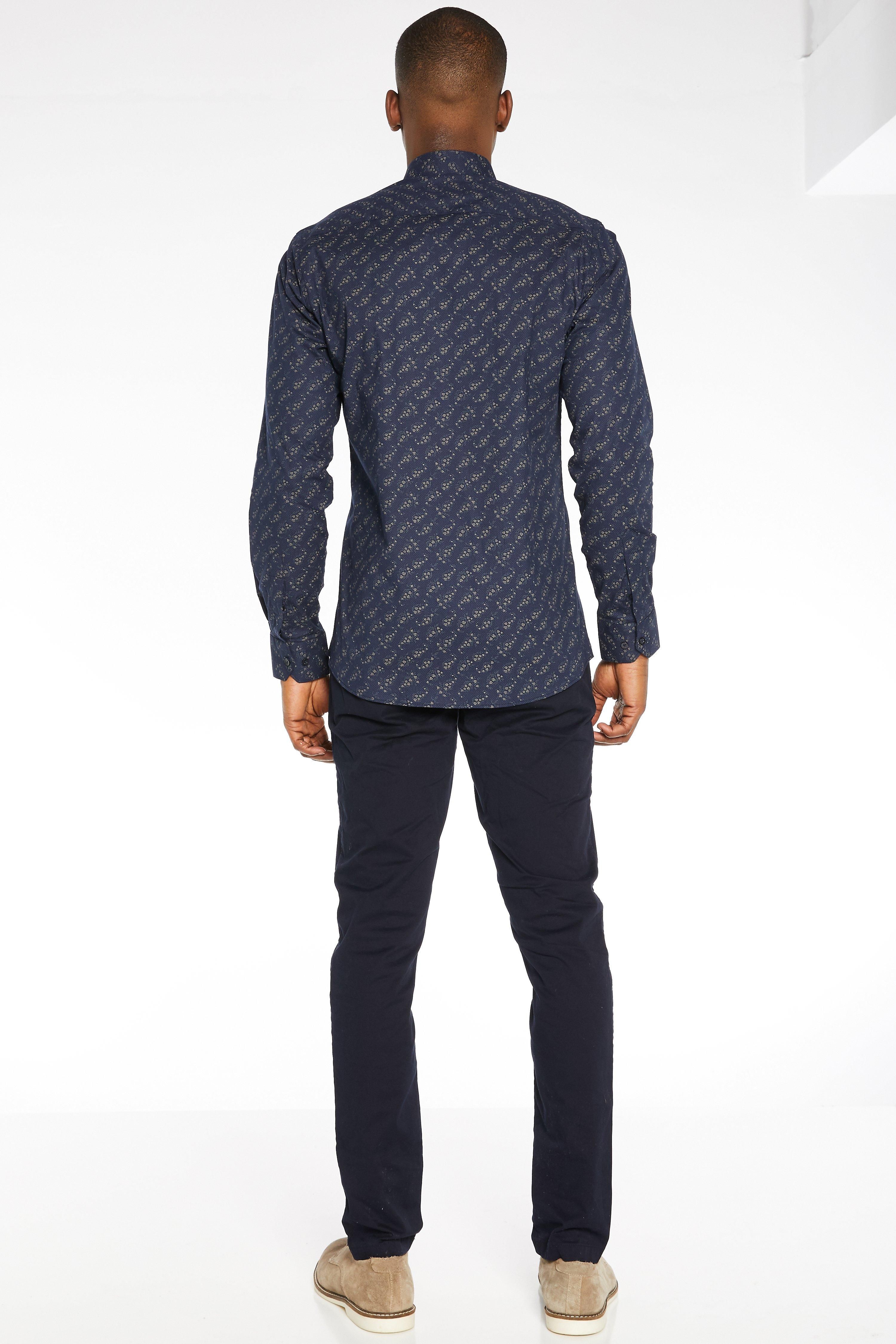 - Slim Fit  - Long Sleeved  - Floral Leaf Print  - Classic Collar  - Button Through Fastening